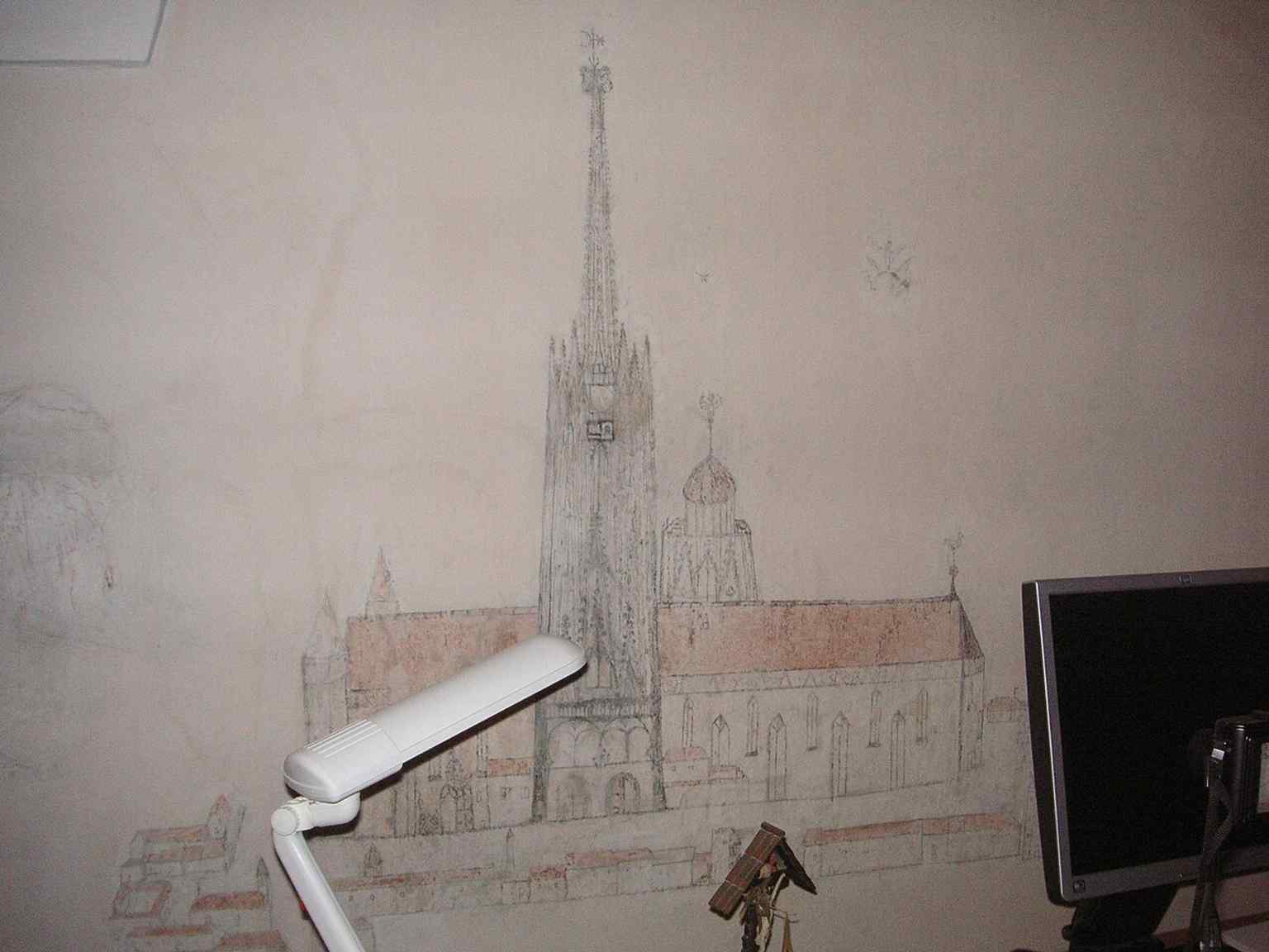 The painted workroom shows that the convent still contains lived-in monastic spaces, not just church and library rooms.