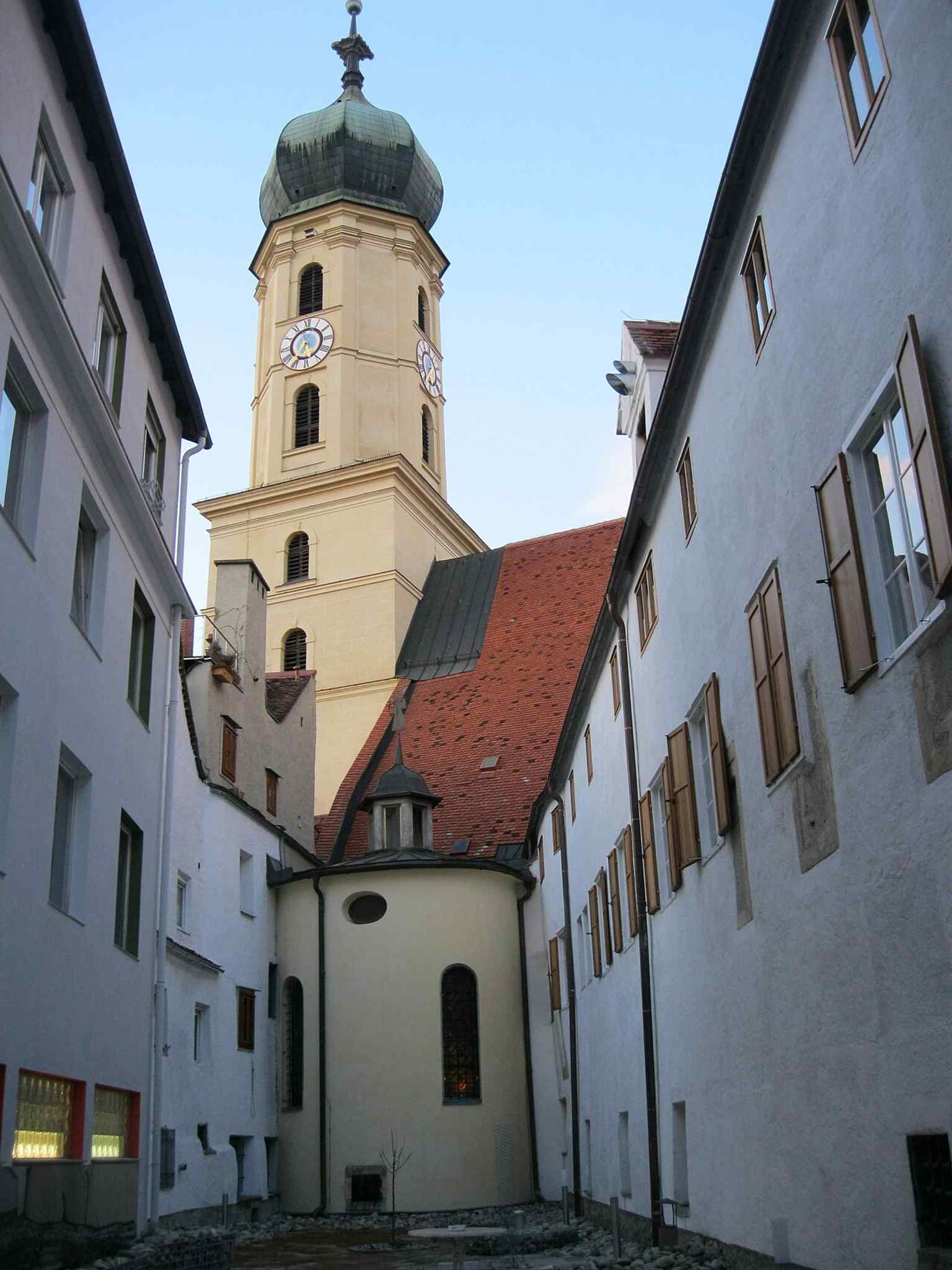 The back side of the monastery beside the old city wall recalls how this Franciscan site once stood on the edge of the medieval city.