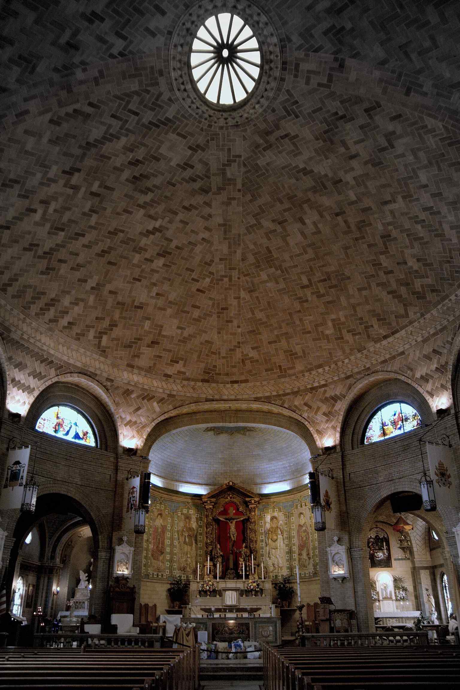 Looking up into the dome from inside the church, a dramatic view of the space designed by Rafael Guastavino in 1905.