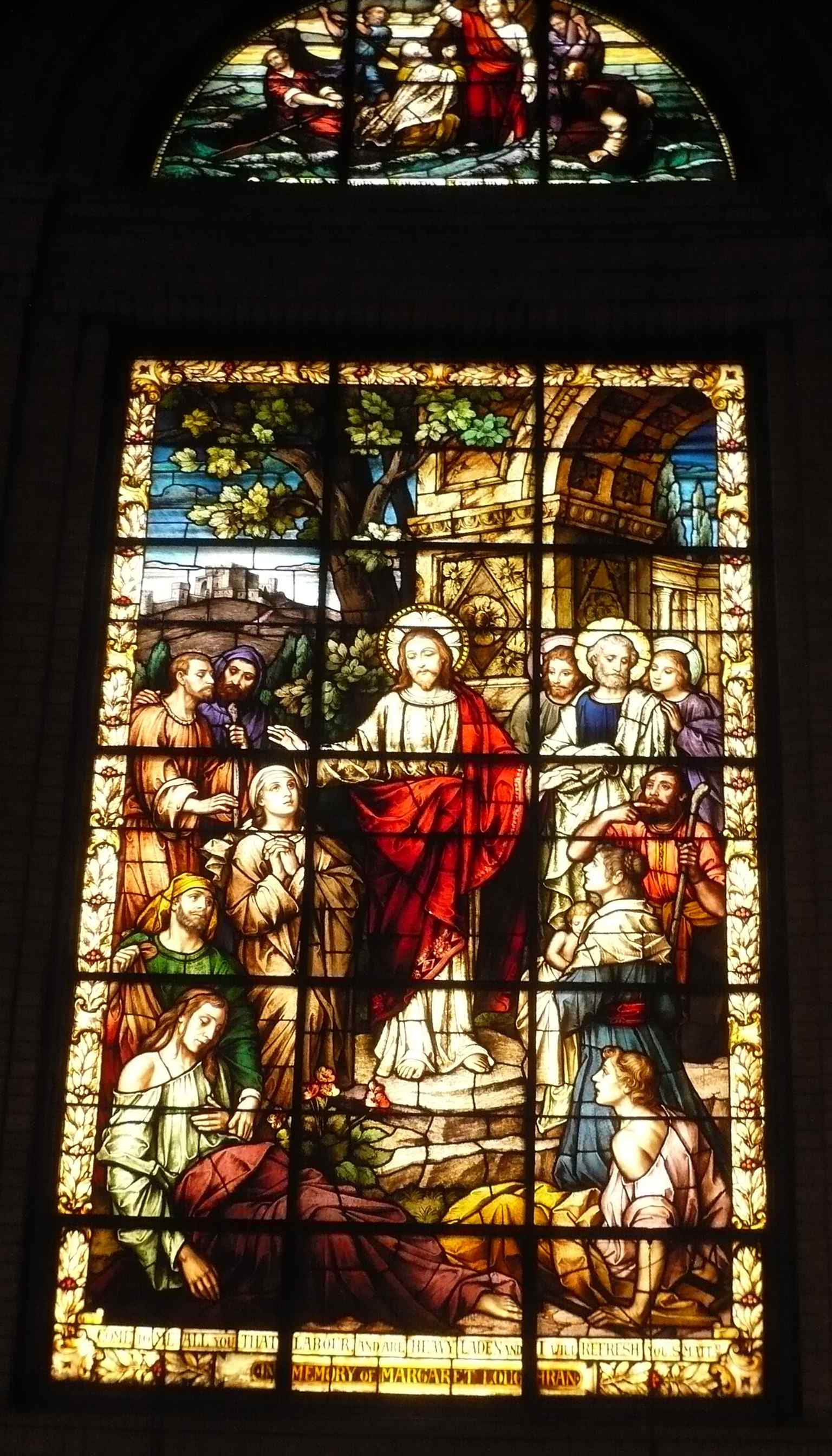 A stained-glass scene of Christ healing the afflicted, part of the basilica’s celebrated window cycle.