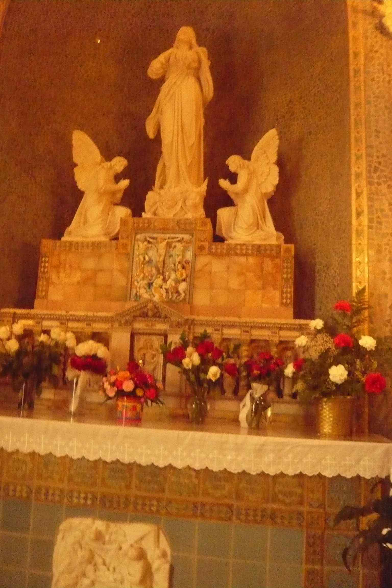 The Chapel of Our Lady’s Marian altar, where devotional details honor the Virgin Mary with marble, carvings, and icons.