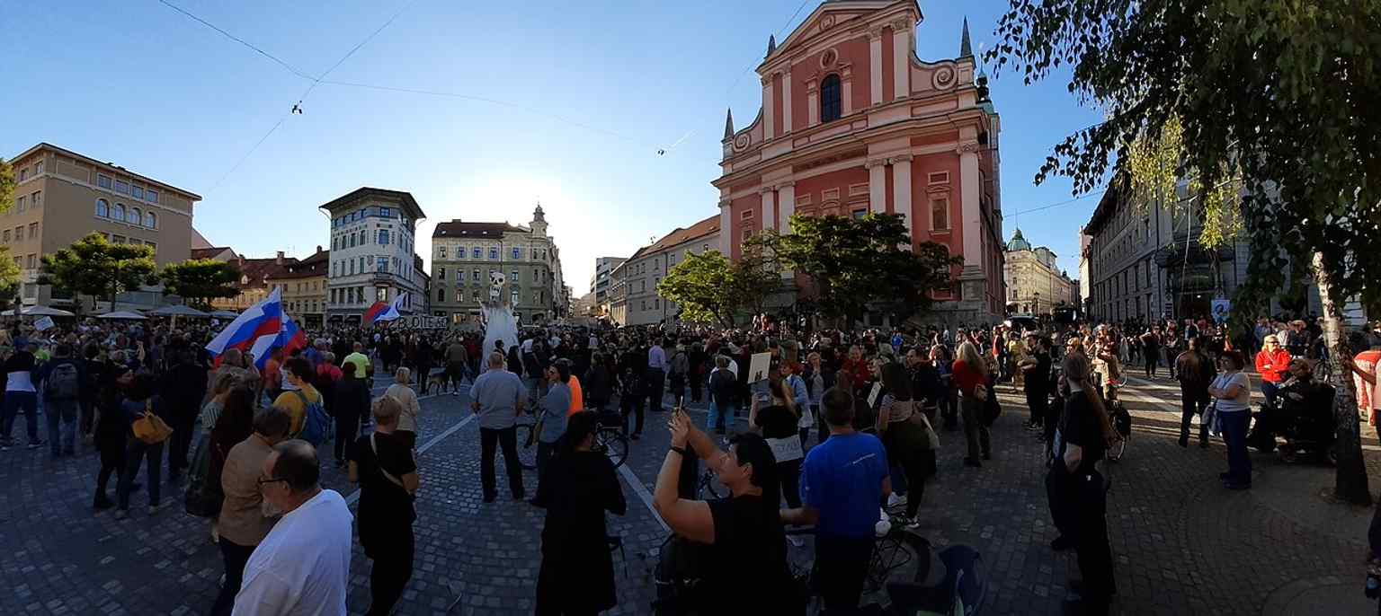 This image captures a 2020 anti-government protest, highlighting Prešeren Square's enduring role as a central gathering place for public demonstrations and dissent, a tradition that continued from World War II.