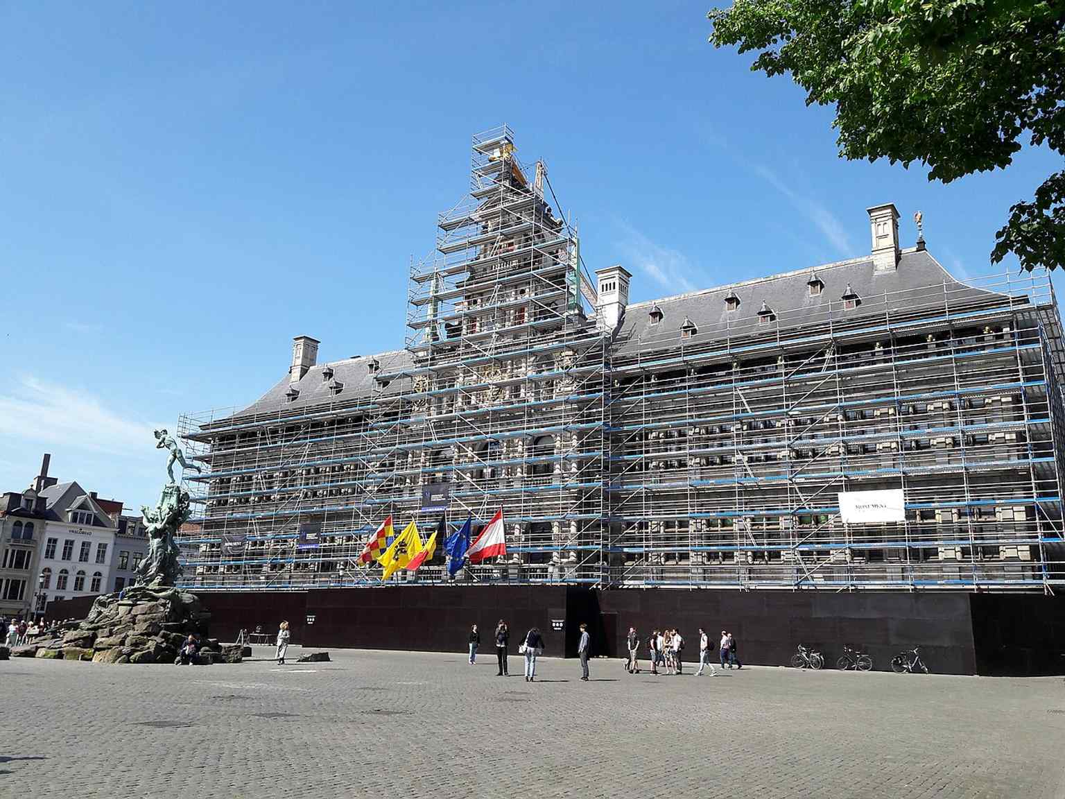 Another restoration-stage view shows the City Hall wrapped in scaffolding, evidence of the major 2018–2020 repair campaign.