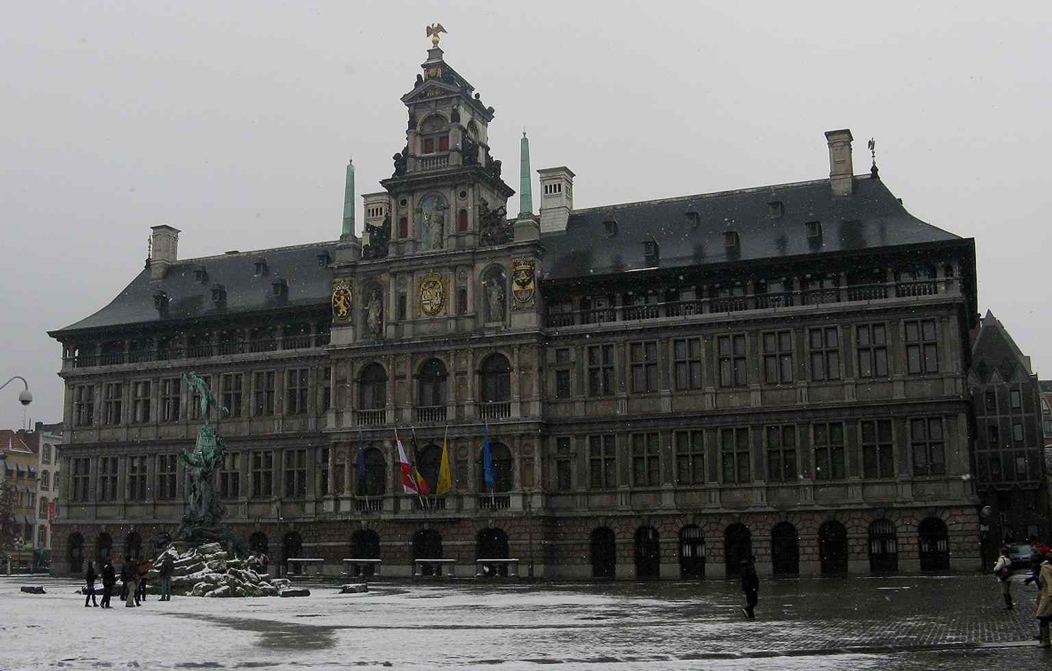 Snow softens the Renaissance façade, offering a moody seasonal view of one of Antwerp’s most recognizable UNESCO-listed landmarks.
