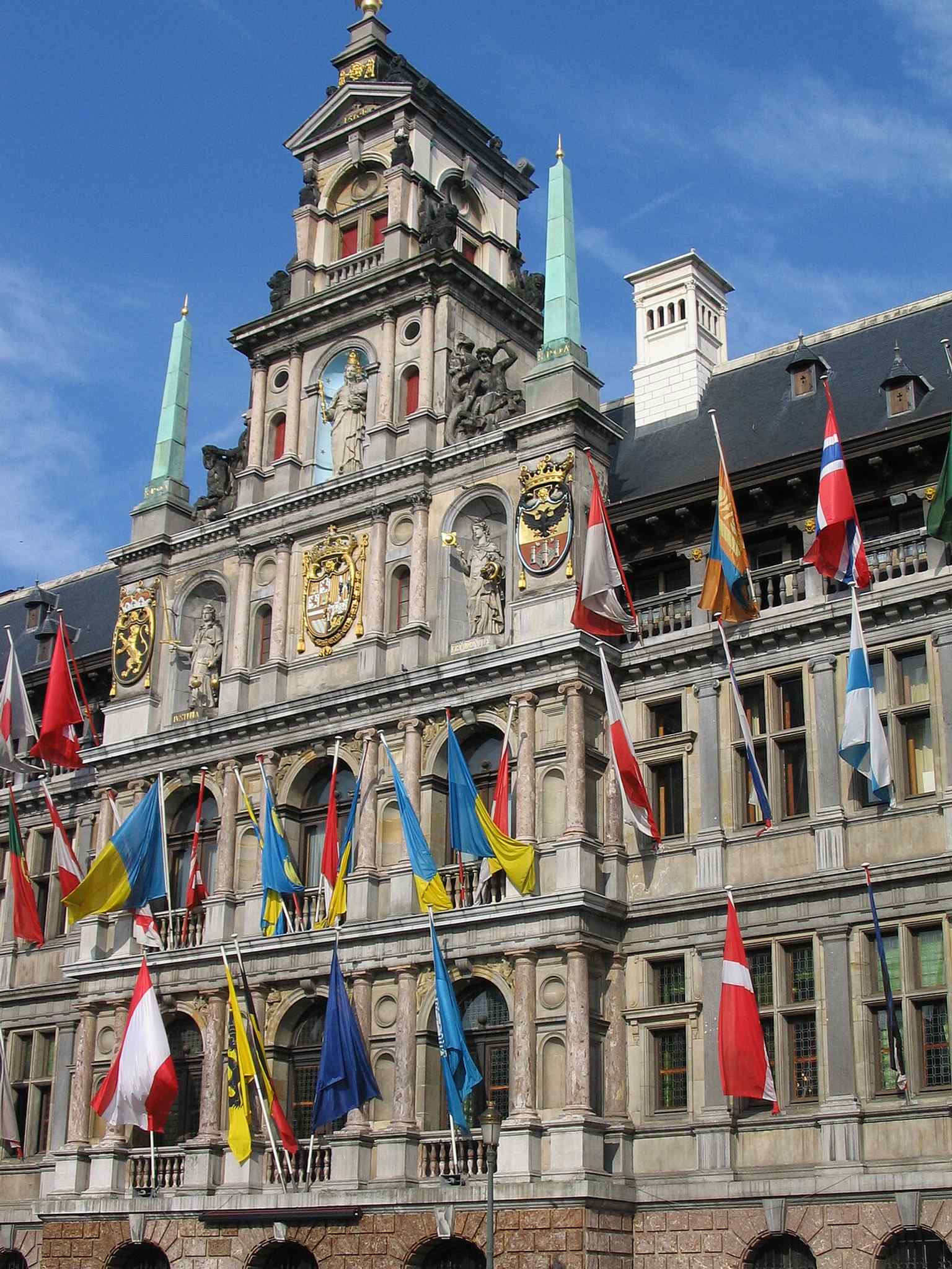 This façade detail highlights the rich sculptural program on the City Hall, including the symbolic figures placed above the main stories.