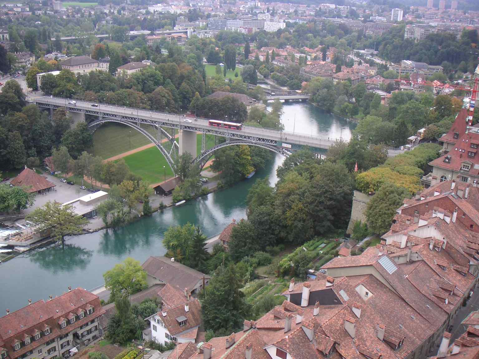 View of the Kirchenfeld Bridge spanning the Aare river, showcasing its distinctive arch construction as the third of its kind in Switzerland when it was inaugurated in 1883.