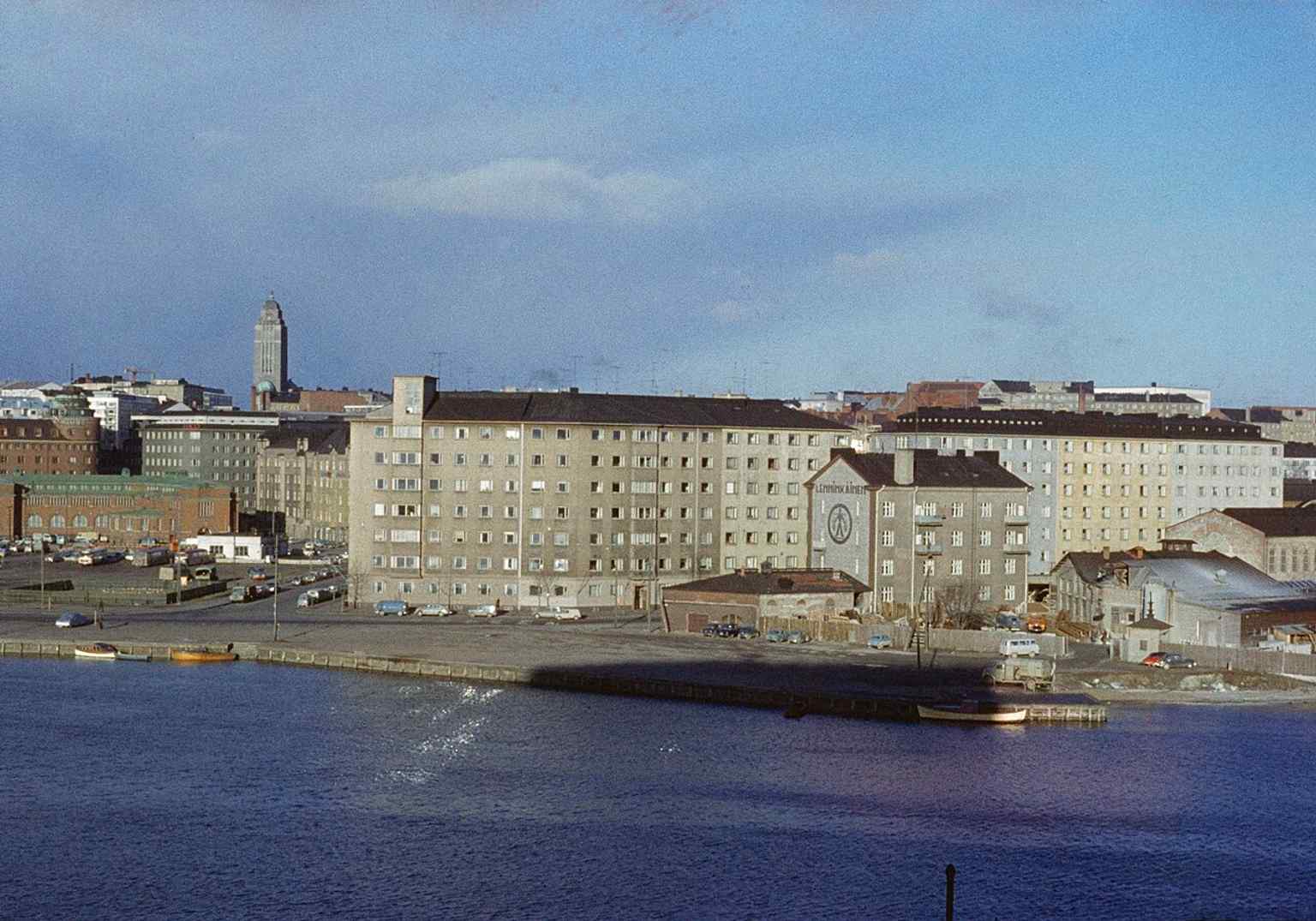 Hakaniemi’s waterfront with the market hall and Kallio Church in the background — a classic view of the area’s edge by the bay.
