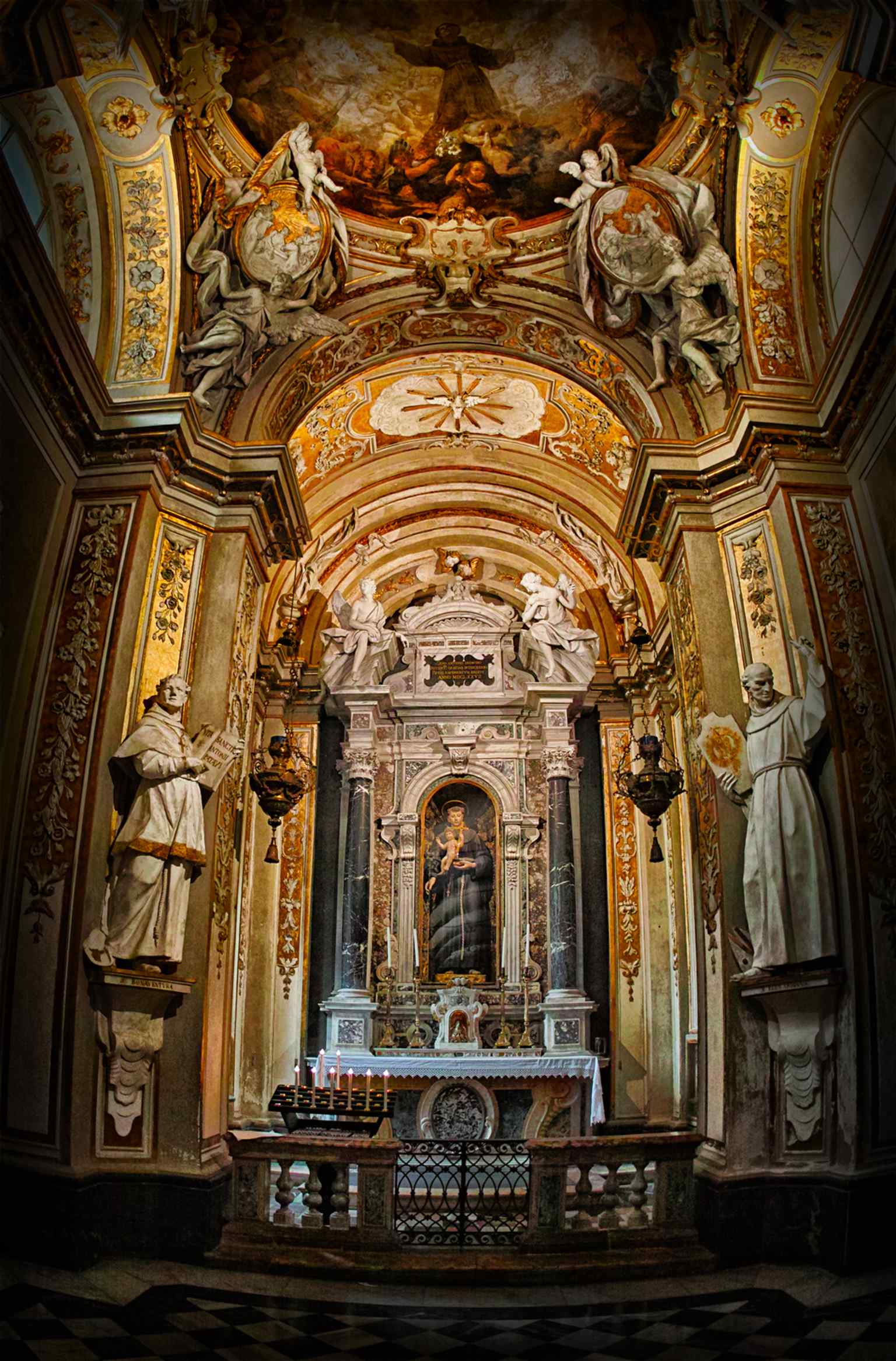 A wide interior shot that reveals the basilica’s three-aisled plan and the long walls lined with the famous mosaic cycles.