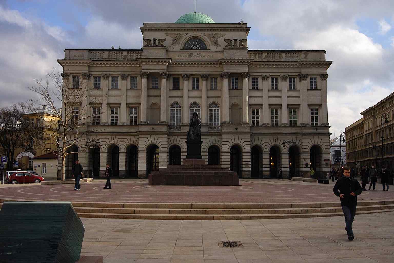 The Copernicus Monument framed with the Staszic Palace behind it, just as it stands on Krakowskie Przedmieście in front of the Polish Academy of Sciences.