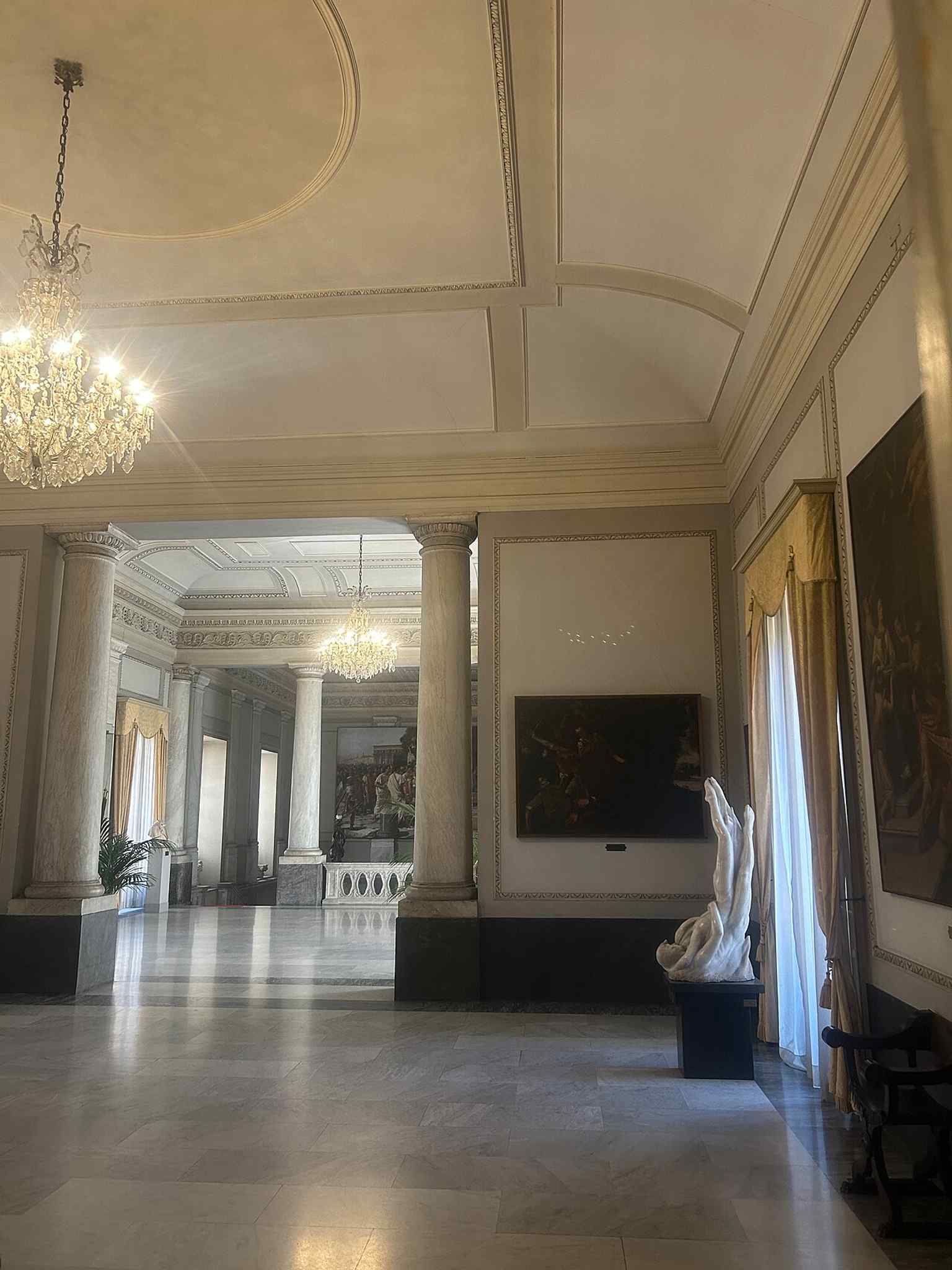 The main stair landing at the entrance, a later 19th-century addition by Stefano Ittar that connects the exterior to the ceremonial interior.