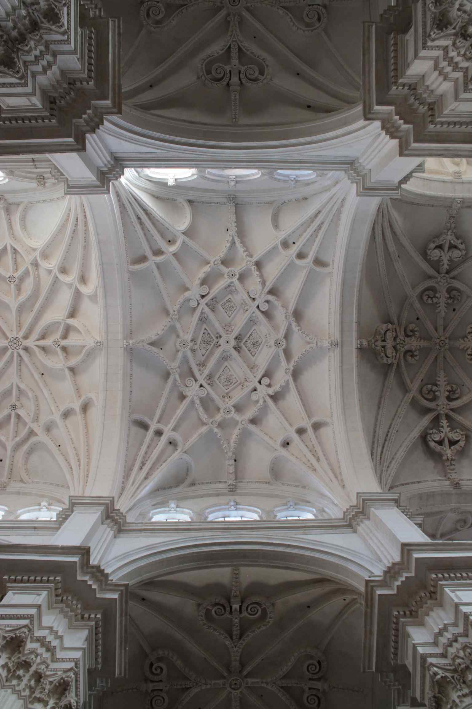 Look up to admire the cathedral's dome, adorned with gold stars on a blue field and a central oculus surrounded by distinctive petal shapes, reflecting Siloé's blend of Renaissance and Gothic.