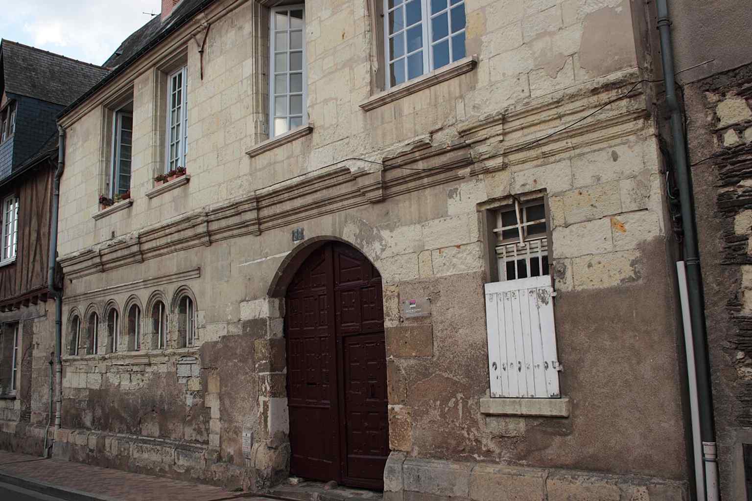 An exterior view of the Convent of the Carmel, which has been classified as a historic monument since 1963, preserving its legacy through centuries of change.