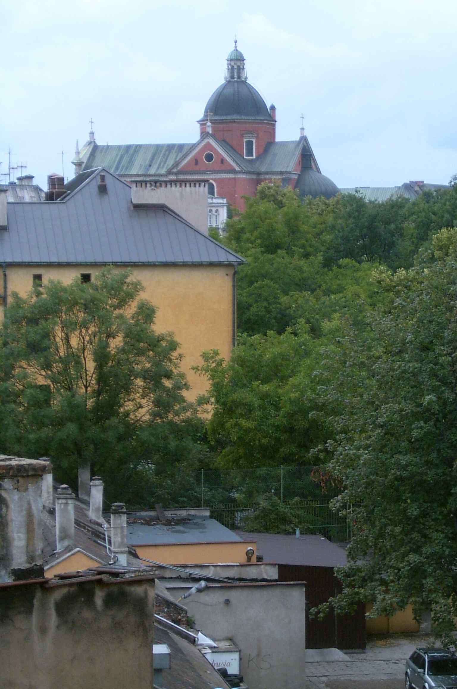 Street-level exterior of the church in its urban setting on Grodzka Street, matching the landmark’s Old Town location.