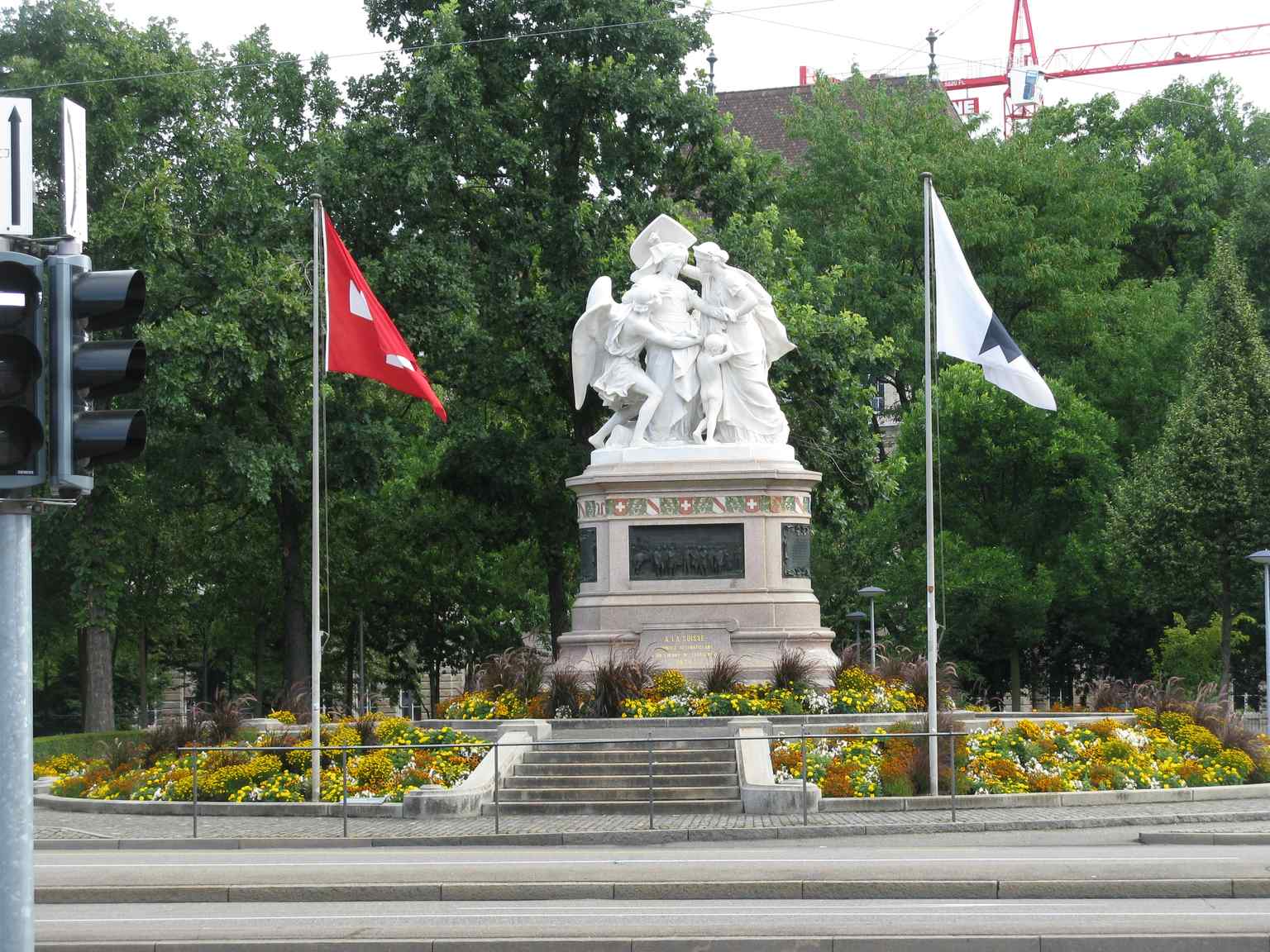 This wider exterior shot captures the monument from a different angle, providing a more comprehensive view that may include the poignant back figure group of a desperate mother and children, adding a human dimension to the allegorical front.