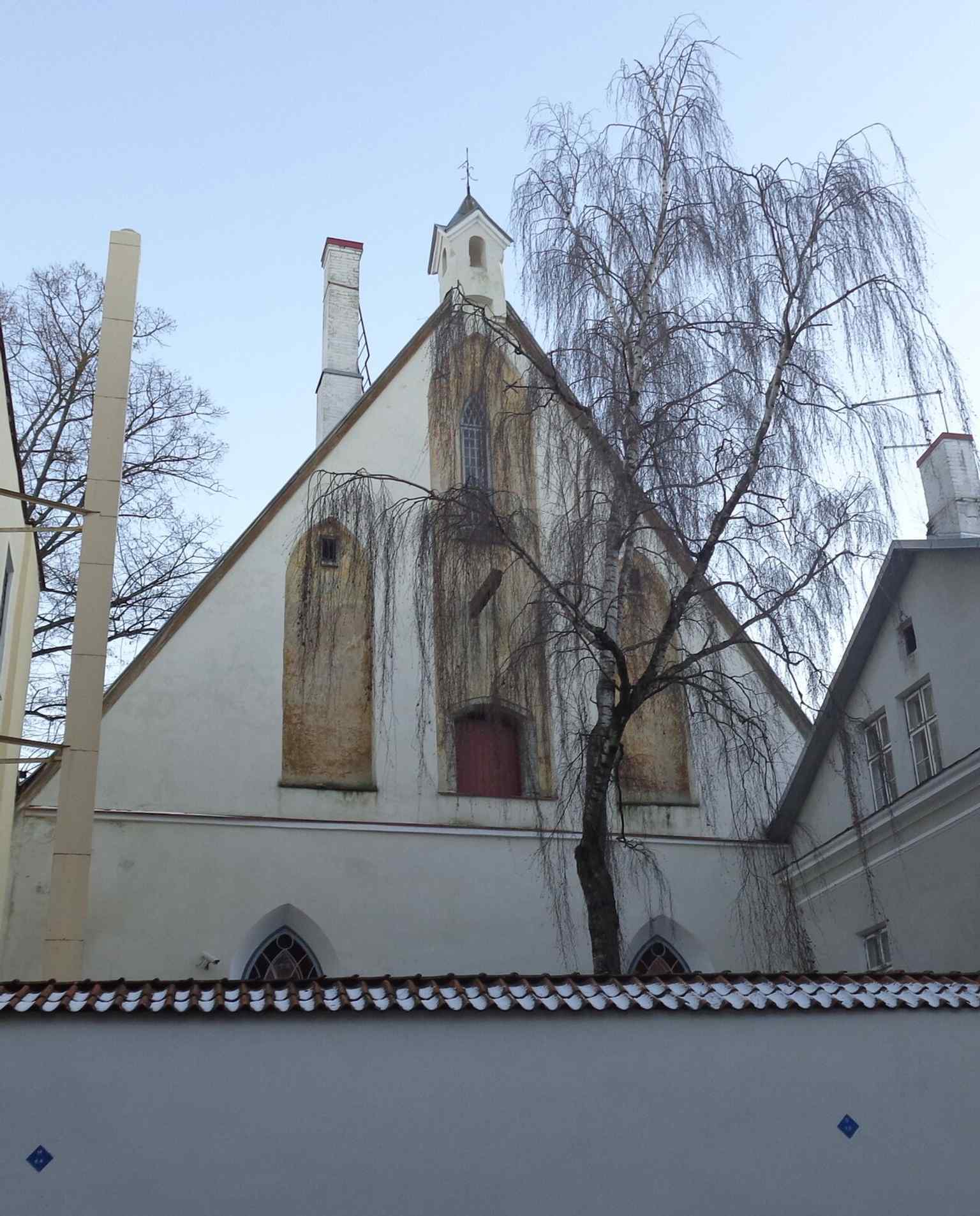 A tighter view of the rear façade on Lai Street, useful for showing the building’s less ceremonial side and its reconstructed back wall.