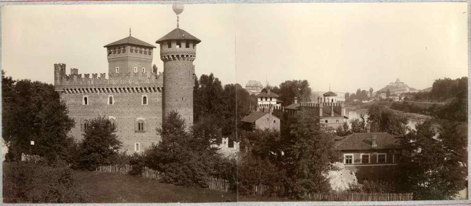 A vintage view of the village from the 1898 General Exhibition, reflecting the experimental architectural ambitions of its creators.