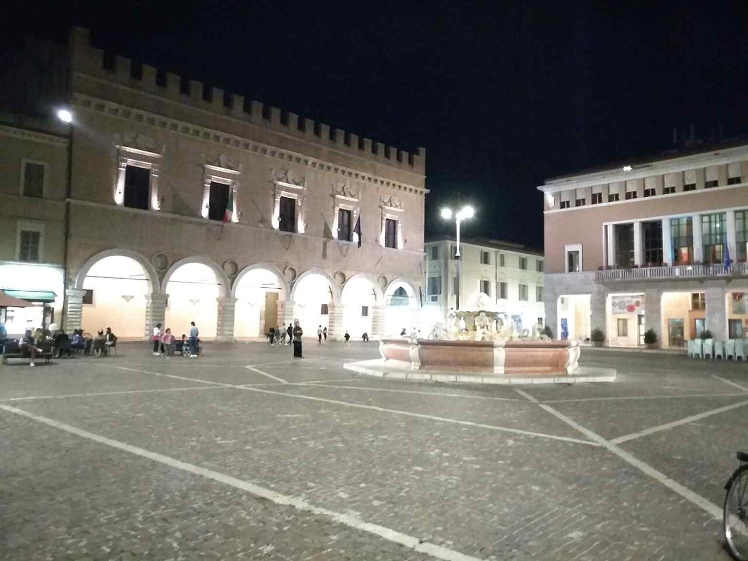 The Prefecture on Piazza del Popolo, part of the historic four-sided frame that defines Pesaro’s civic square.