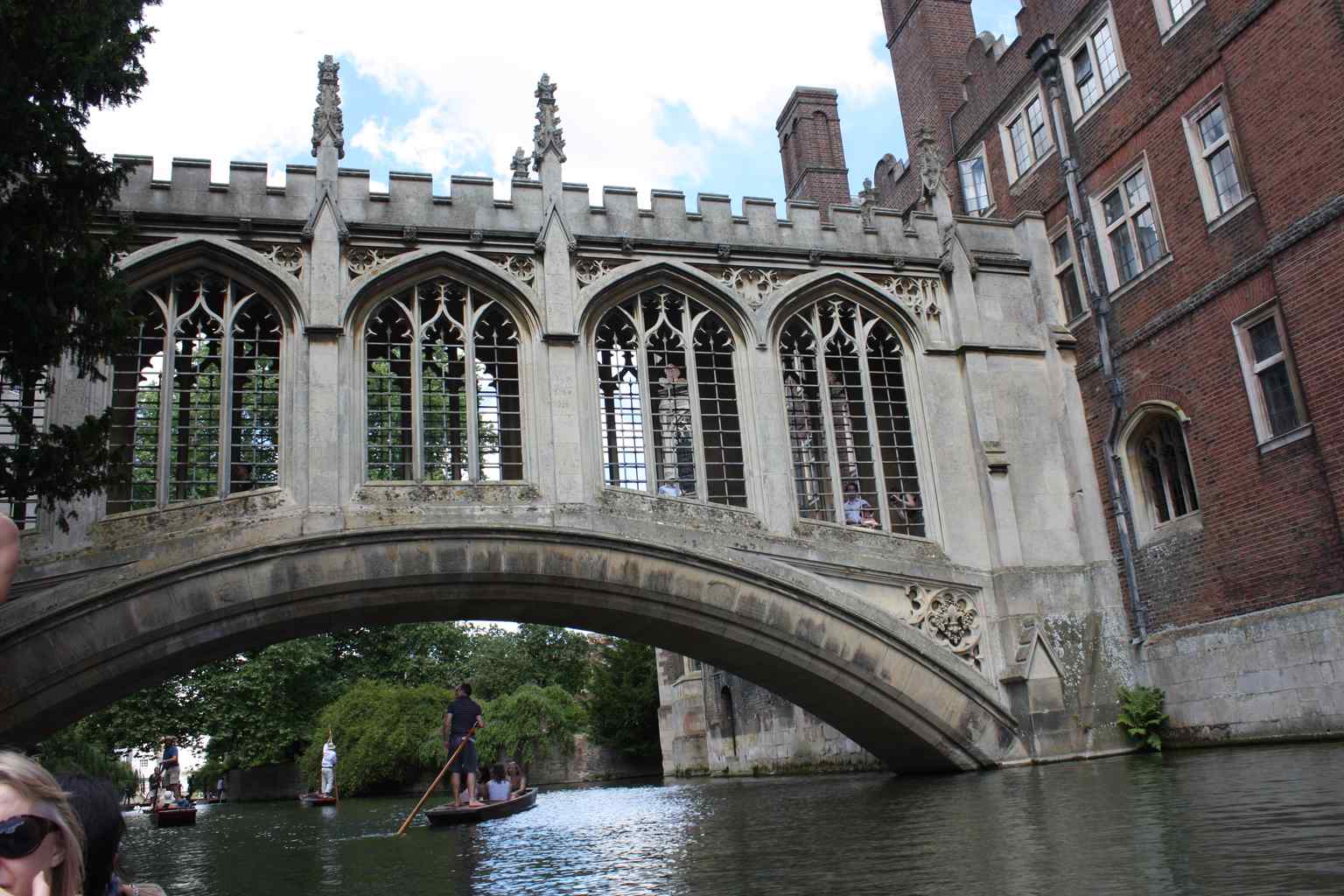 See how the Bridge of Sighs acts as a vital artery, linking St John's College's Third Court and New Court, representing a significant urban development for Cambridge.