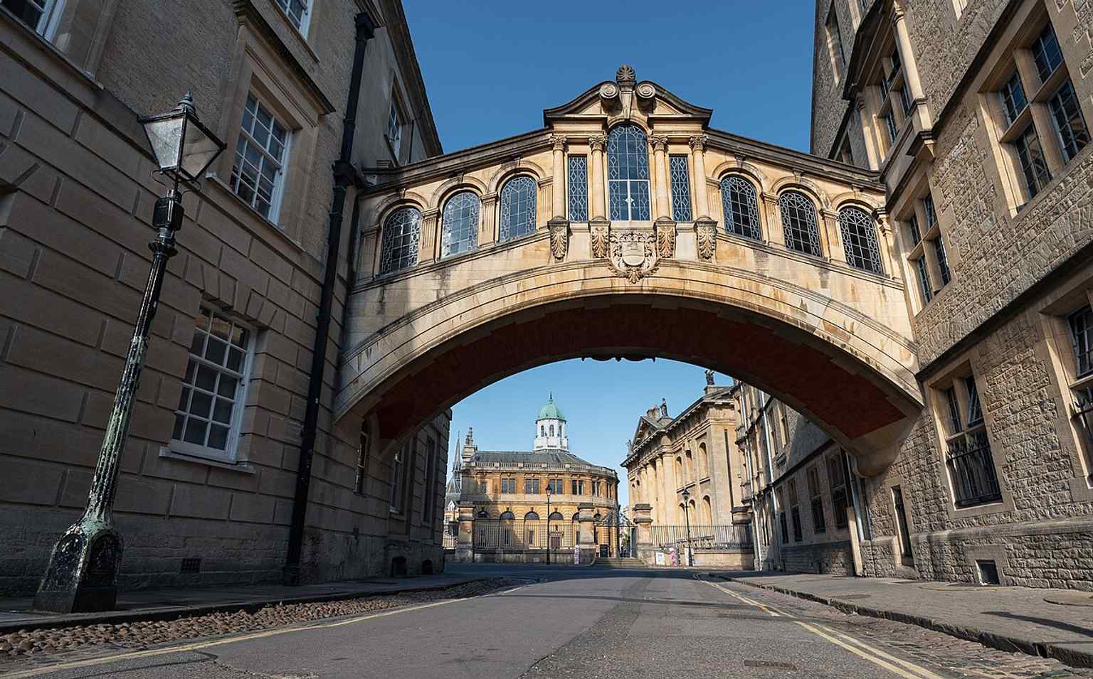 The bridge seen from the east with the Sheldonian Theatre behind it, placing the landmark in central Oxford’s historic setting.
