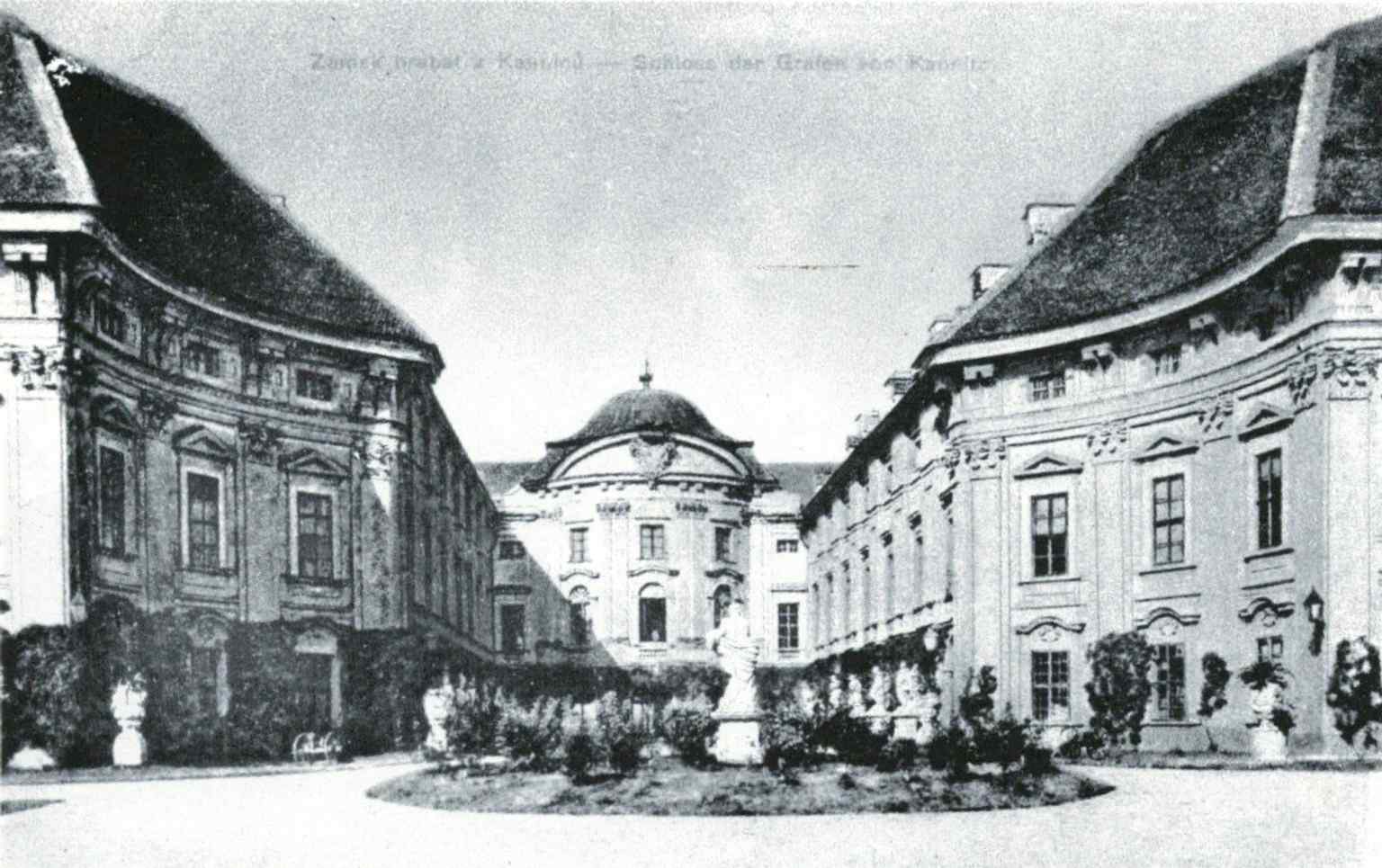 A historical photograph from the early 20th century, showing the ceremonial courtyard of Slavkov Castle, once known as the 'Schloss der Grafen von Kaunitz'.