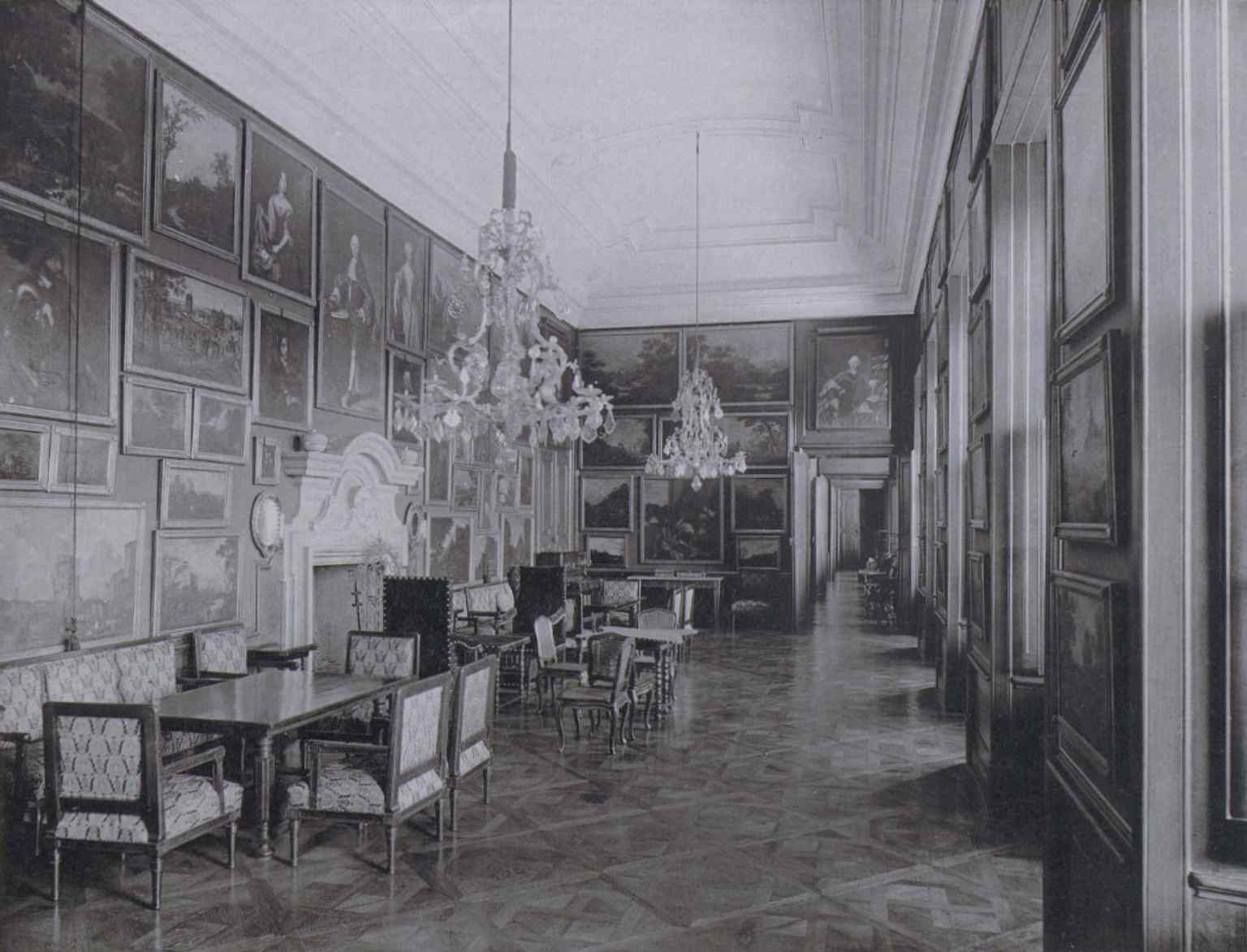 A historical view (1888) of the castle's enfilade, showcasing part of the Kounic family's extensive art gallery that once contained works by famous European masters.
