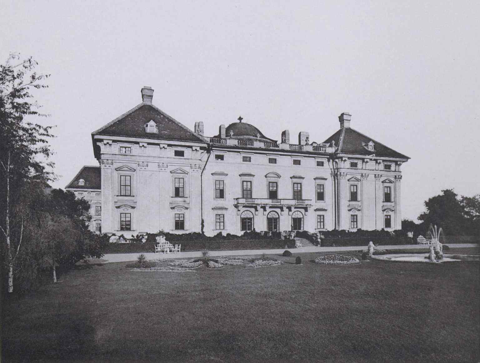 An 1888 photograph of the castle's west facade as seen from the park, showing the earlier configuration of the park, which transitioned to an English style in the 19th century.