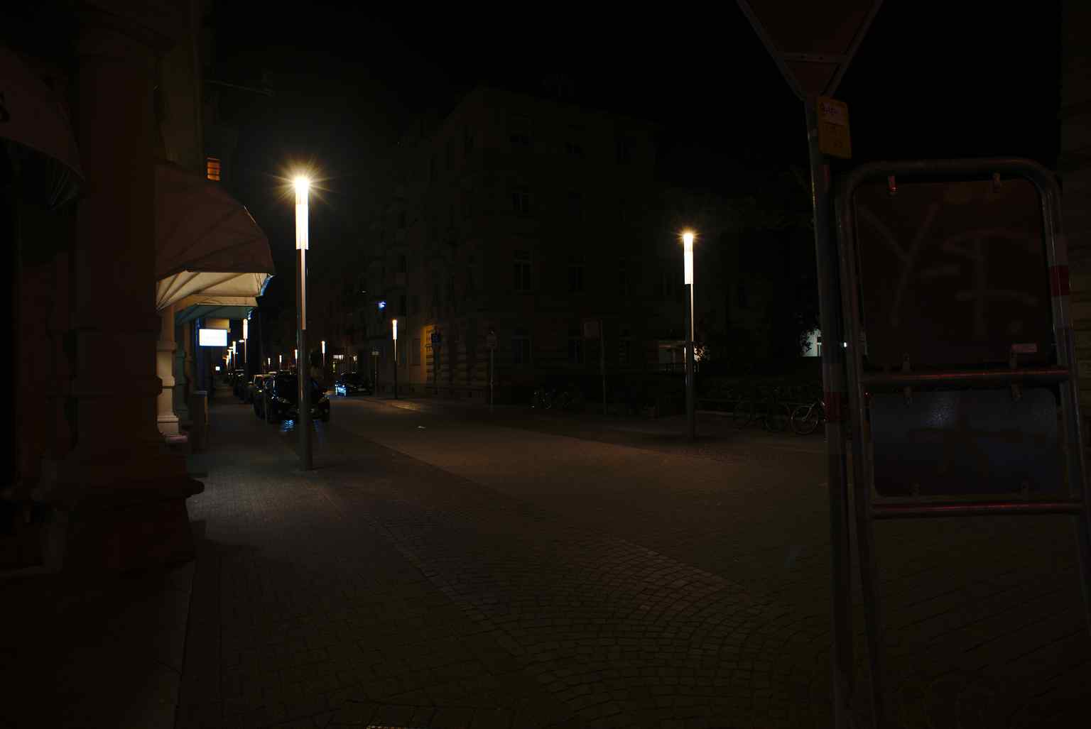 The Kaiserstraße lit up at night in 2019, showcasing its role as Karlsruhe's main shopping street and bustling retail and service center.