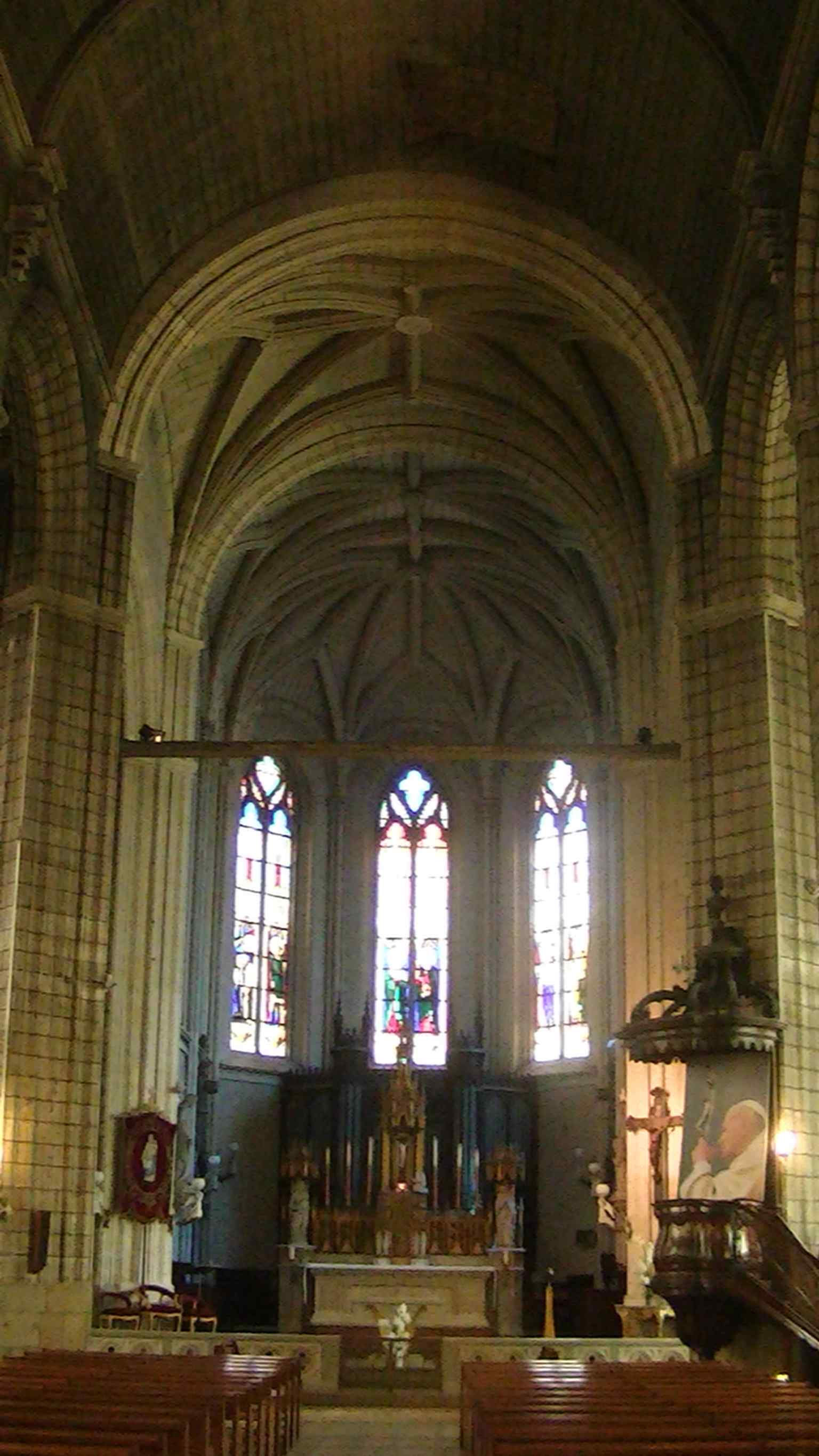 Looking toward the altar, this shot highlights the church’s long nave and the liturgical focus of the interior.