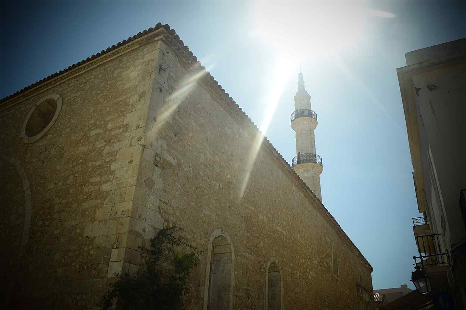 A broad, high-resolution view of the Neradje Mosque, a prominent landmark in the old town of Rethymno, Greece.
