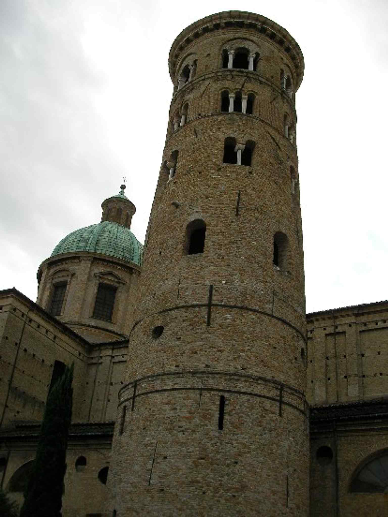 A wider exterior view that helps place the cathedral in Ravenna’s historic center, beside the archbishop’s complex.