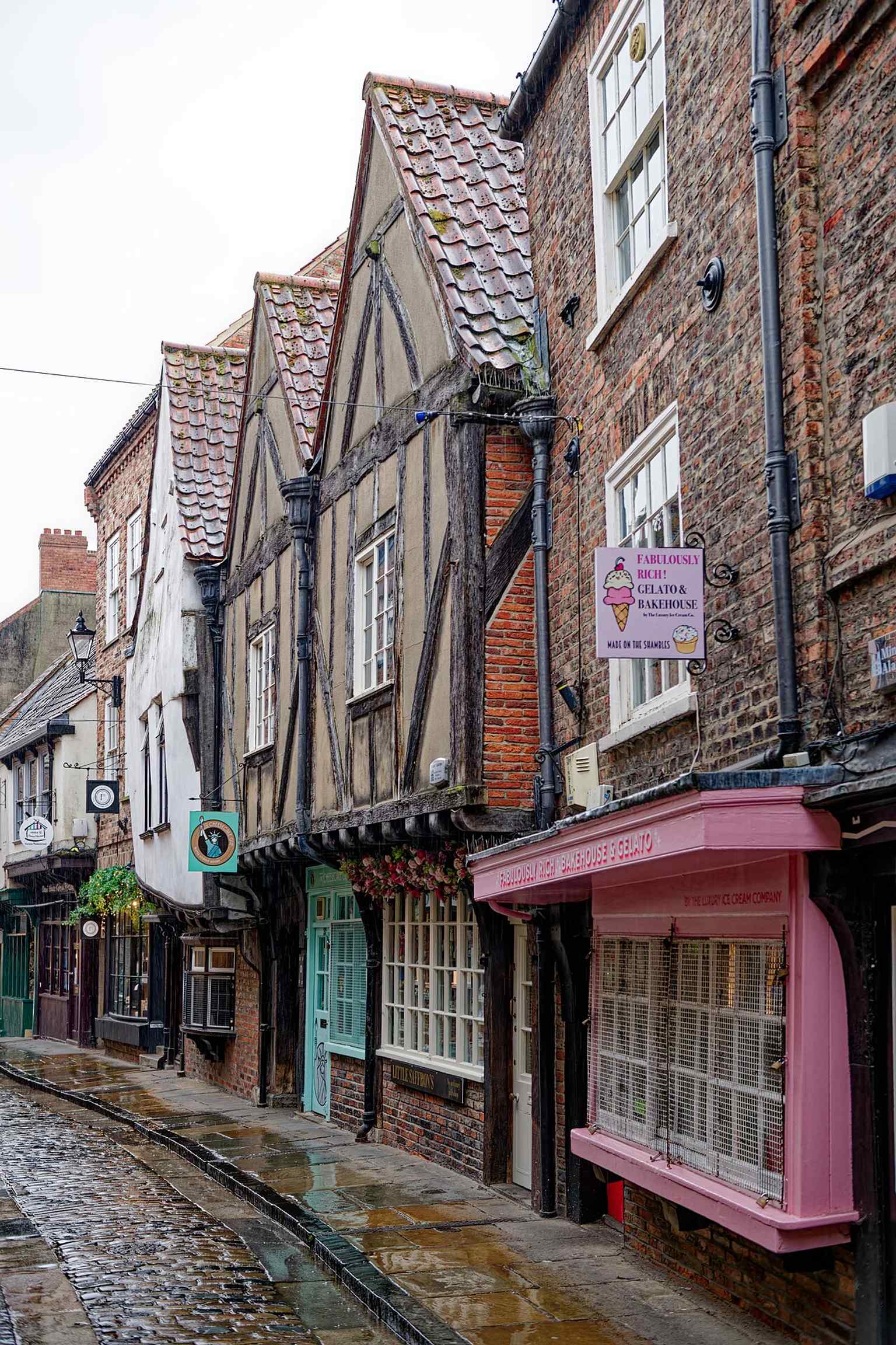 Another well-detailed street-facing view of 37–38 The Shambles, tying the medieval fabric to the modern commercial frontage.