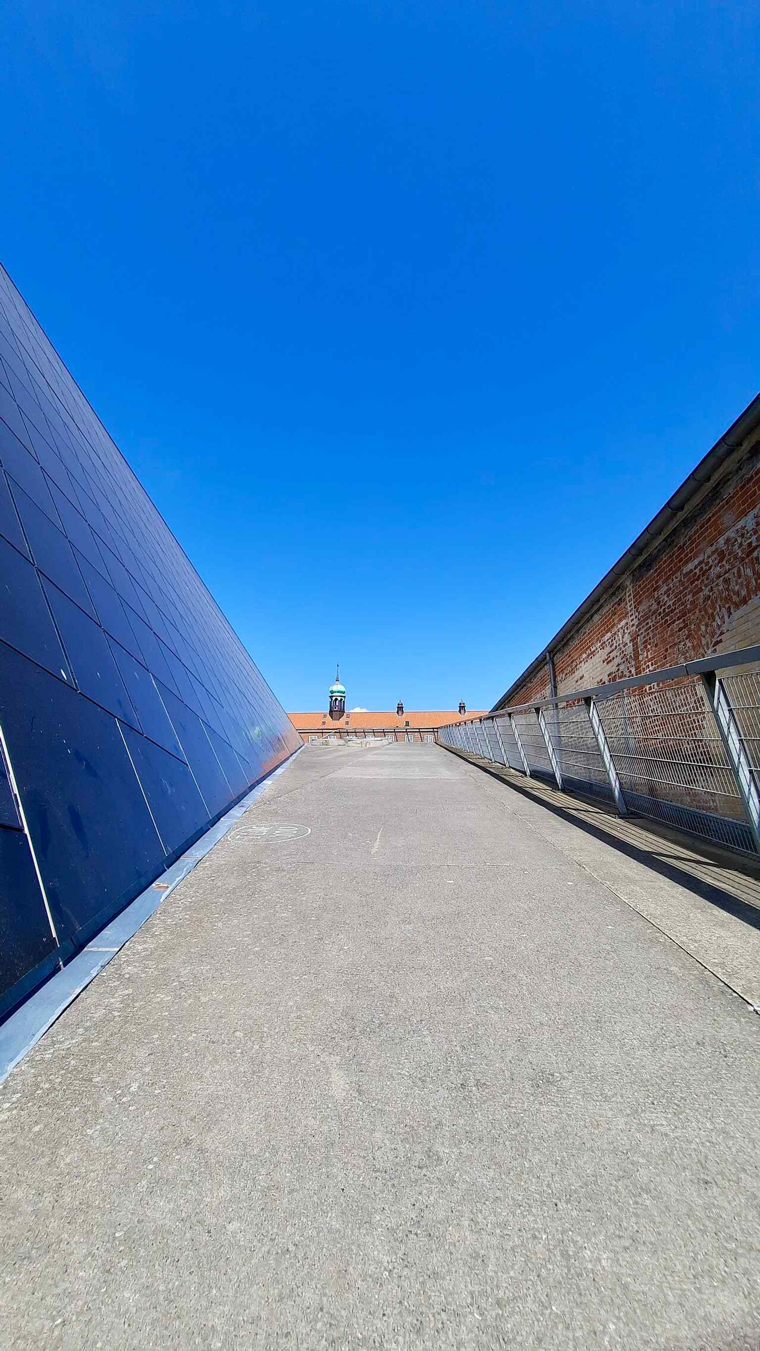 A clear rooftop view of the historic redbrick freight station, now part of Godsbanen’s transformation into a cultural production center.