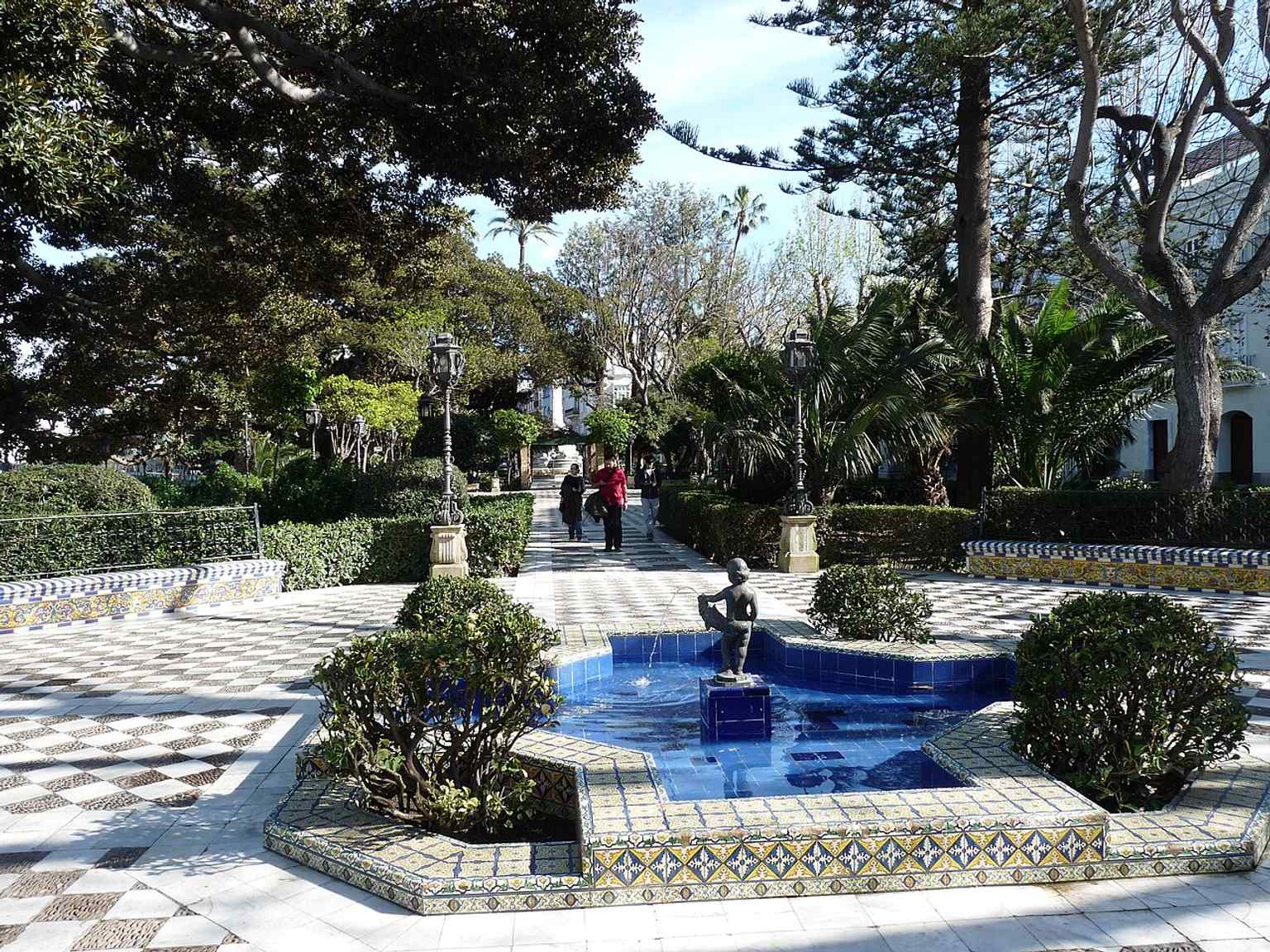 A second view of the Alameda’s fountain-lined walk, showing the landscaped promenade that links the wall and the seafront.