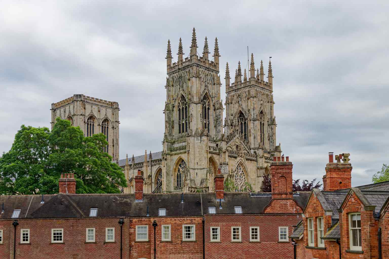 The imposing exterior of York Minster, viewed from the northwest, showcasing its creamy limestone and Gothic architecture (2024).