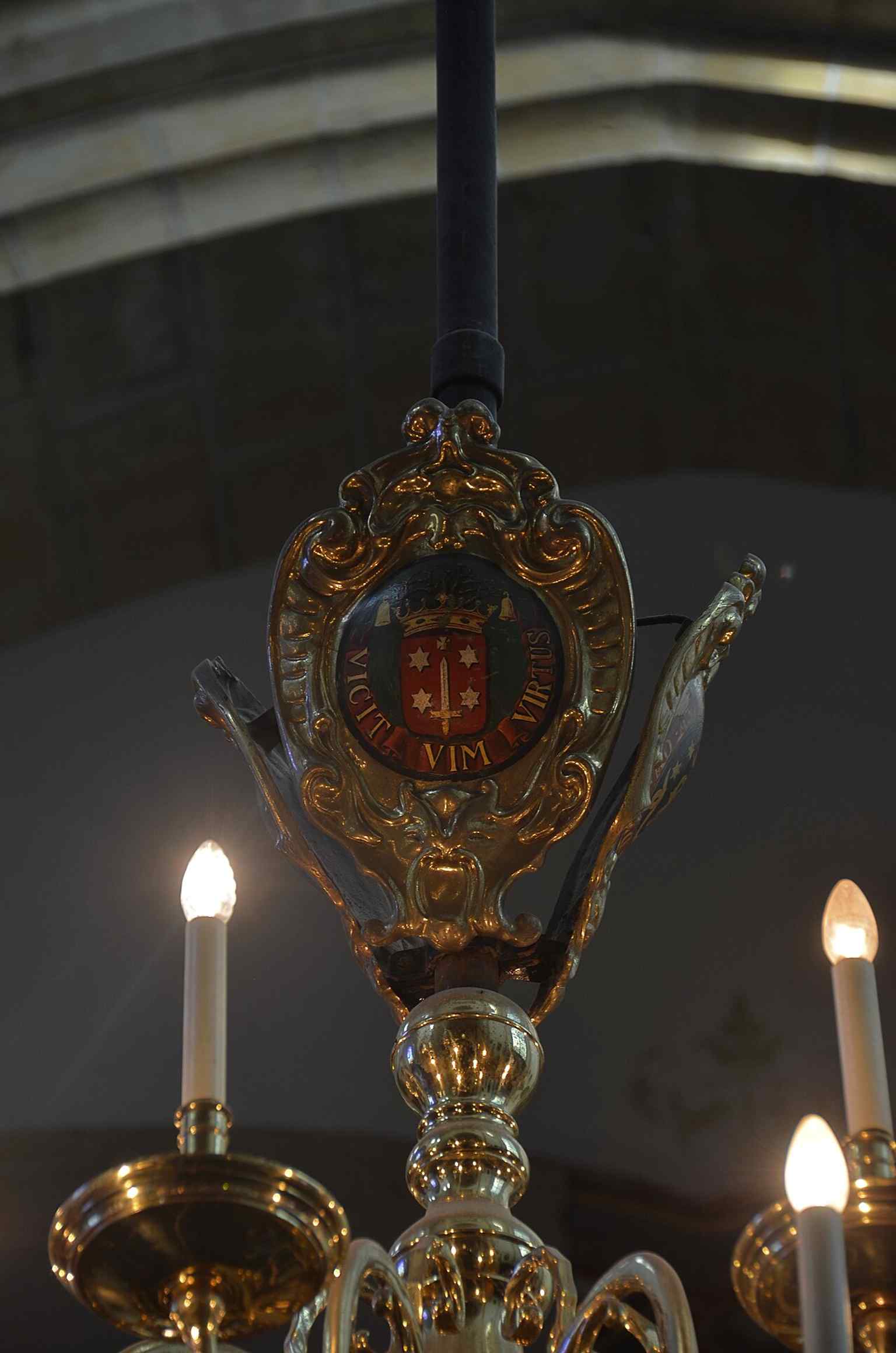 One of the chandeliers, showing how the interior mixes historic fittings with later restoration work.