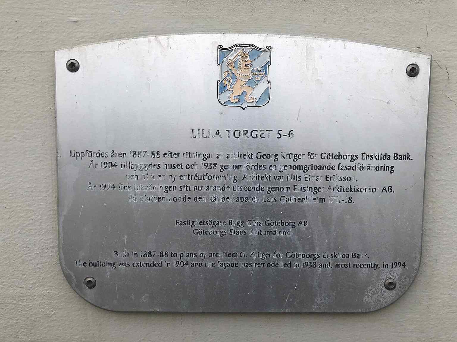 A sign marking Lilla Torget 5, which is part of a project to label significant buildings and represents the modern office and commercial activities surrounding the square today.