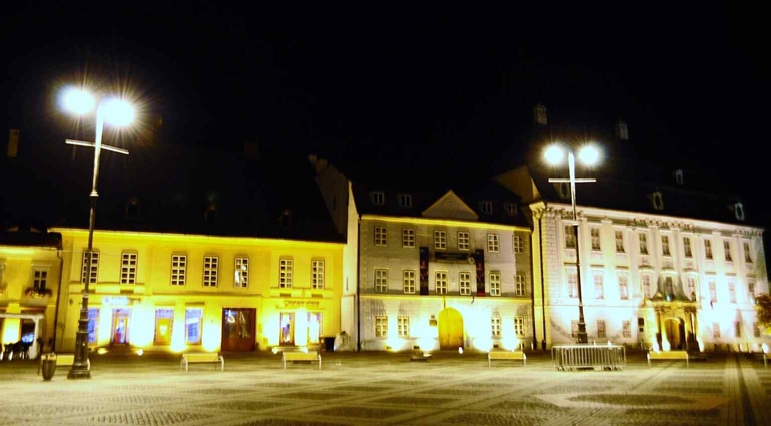 See the Brukenthal Palace alongside the 'Blue House,' one of the other buildings that are part of the museum's extended complex of six distinct cultural institutions.
