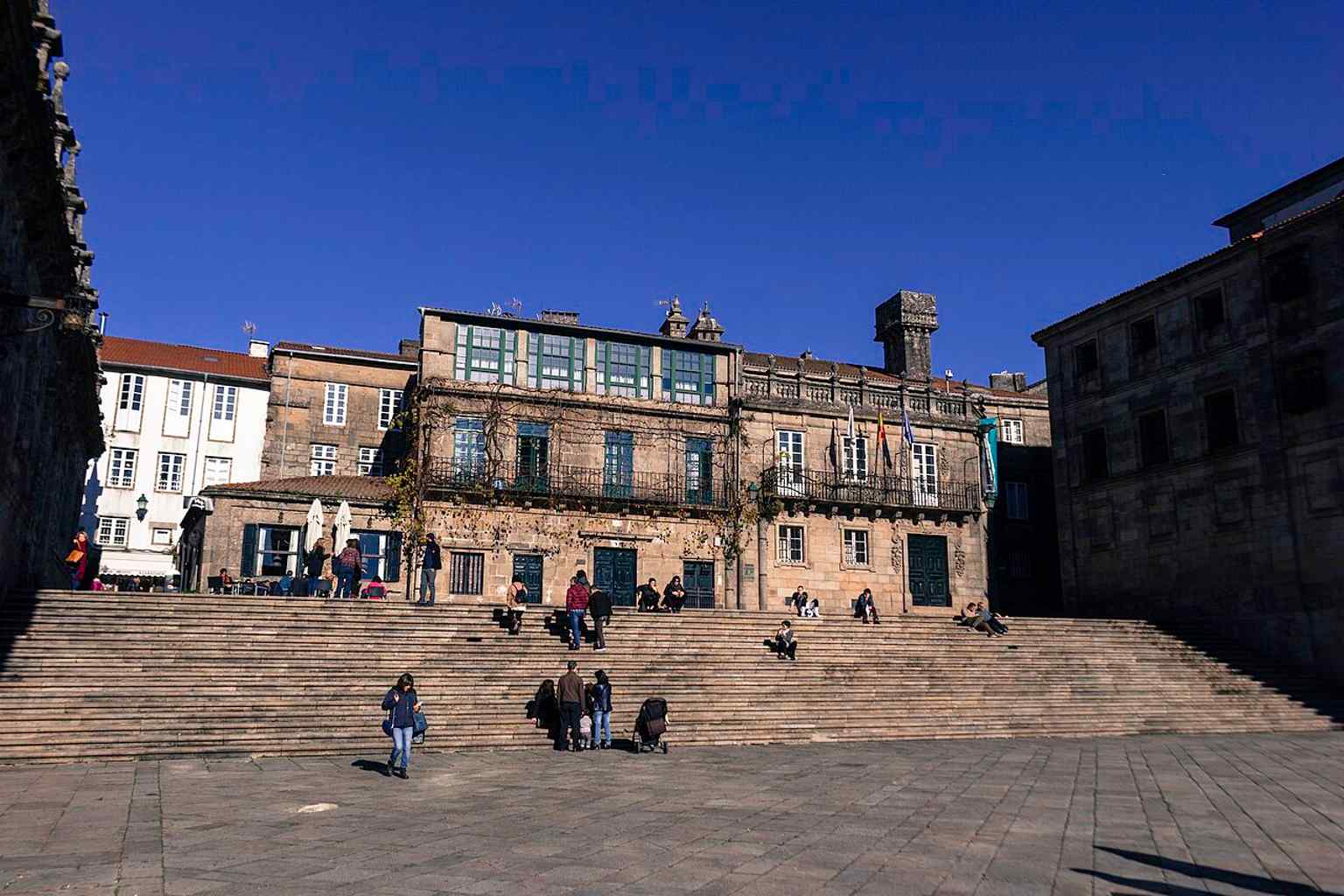 Quintana Square is historically divided by a monumental staircase into the 'Quintana de Vivos' (upper level) and the 'Quintana de Mortos' (lower level), which was once a medieval cemetery.