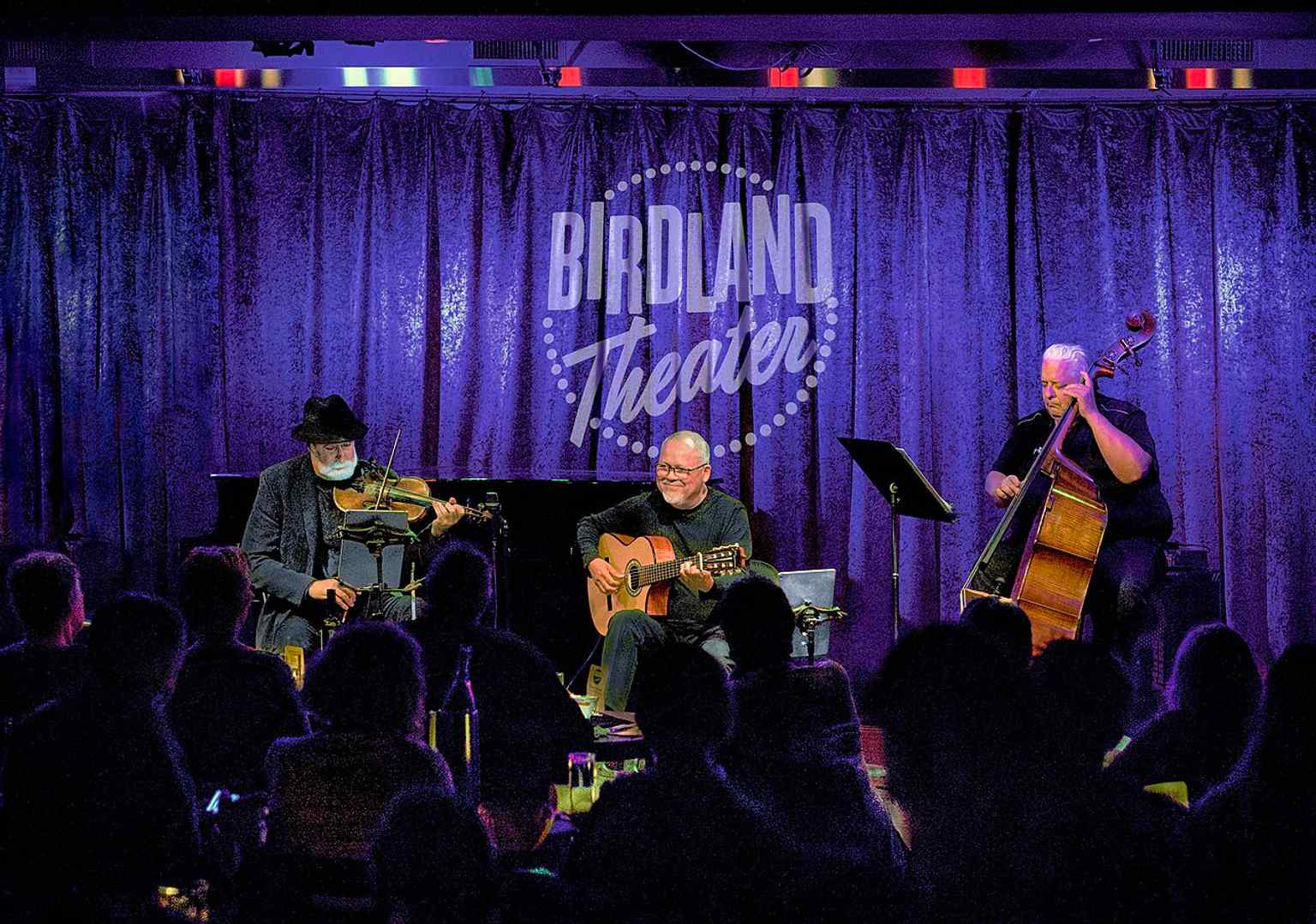 A vibrant interior view of the current Birdland jazz club from 2023, which reopened in 1986 in Manhattan's Theater District and continues to host top performers.