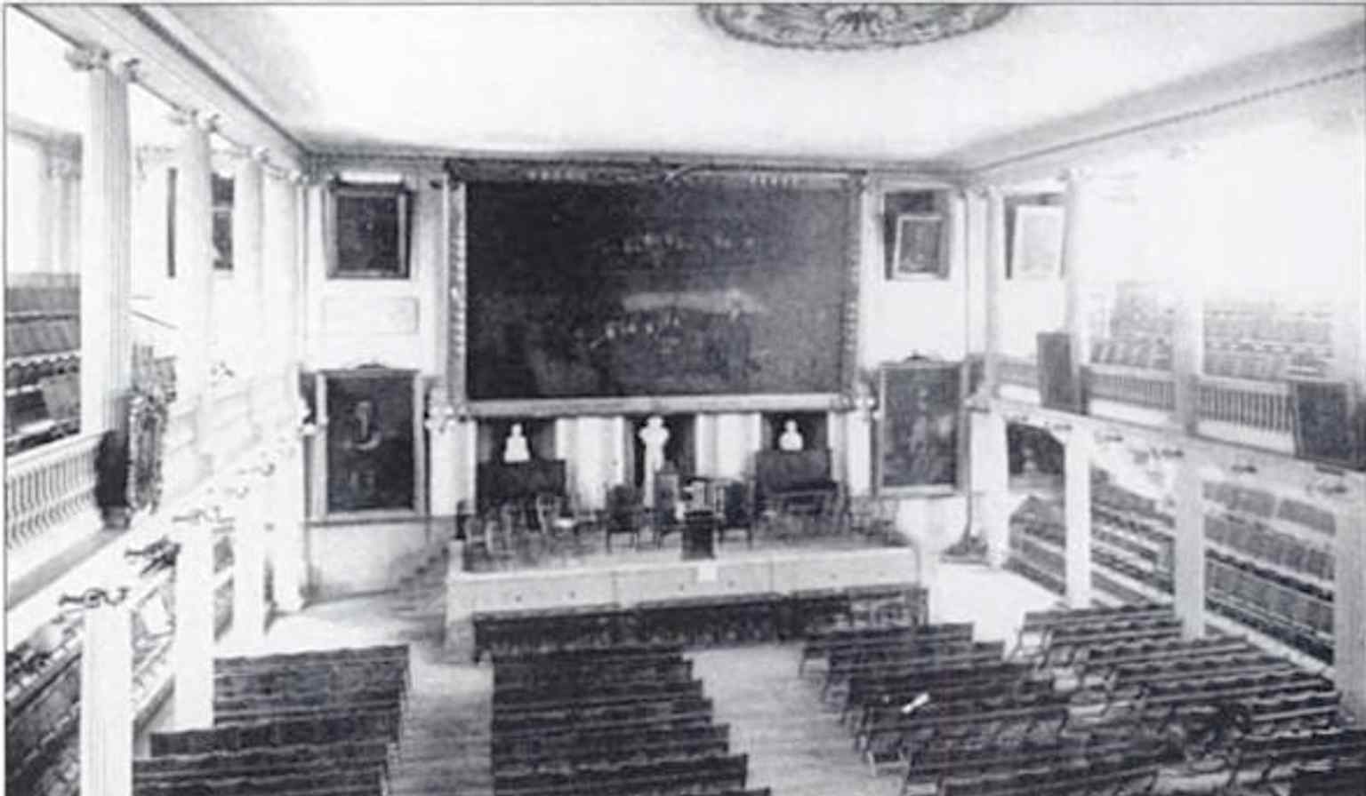 A 19th-century interior view that captures the older market-and-meeting-hall character before later fireproofing and restoration work.