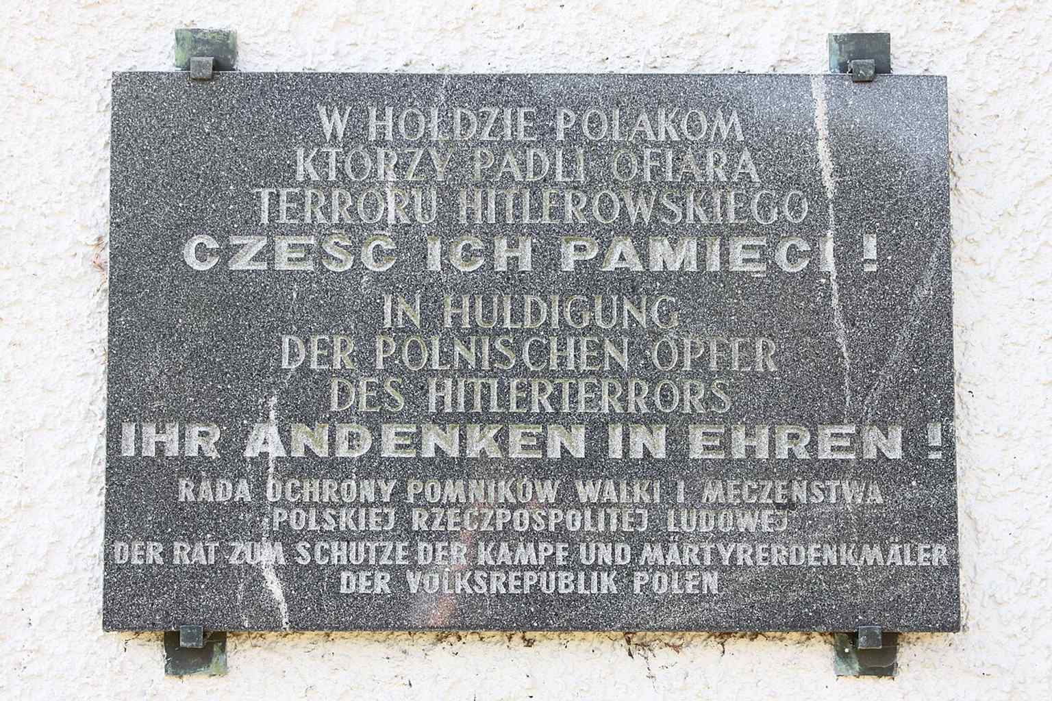 A memorial to the Republic of Poland at the crematorium wall, recalling victims from the Nazi period and the site’s broader wartime history.