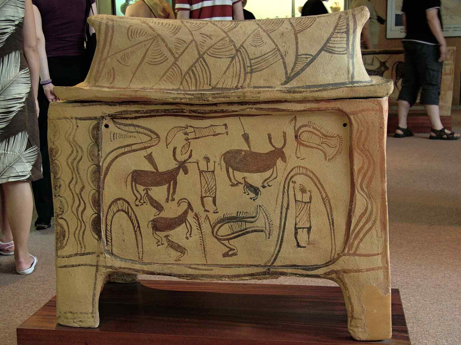 This Early Minoan terracotta funerary chest depicts a vibrant hunting scene and was found in the Armenoi necropolis, a significant Late Minoan site.