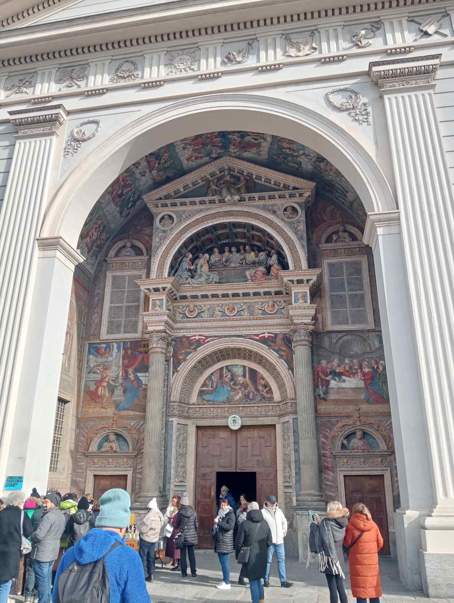The elaborately decorated Renaissance portal, adorned with frescoes and terracotta reliefs dedicated to the Life of the Virgin, is a highlight found within the neoclassical atrium.