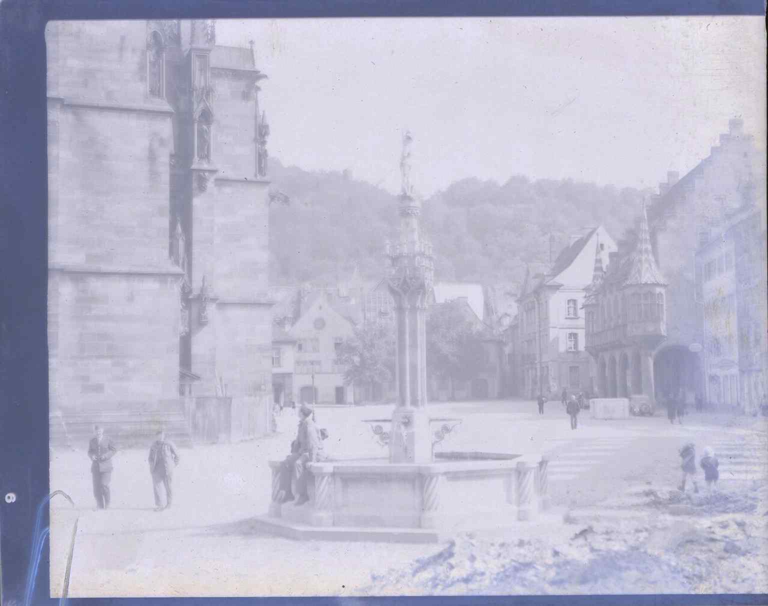 A rare wartime view of Münsterplatz in 1945, with the cathedral and the Historic Merchant’s Hall visible on a square that had just lost much of its surrounding buildings.