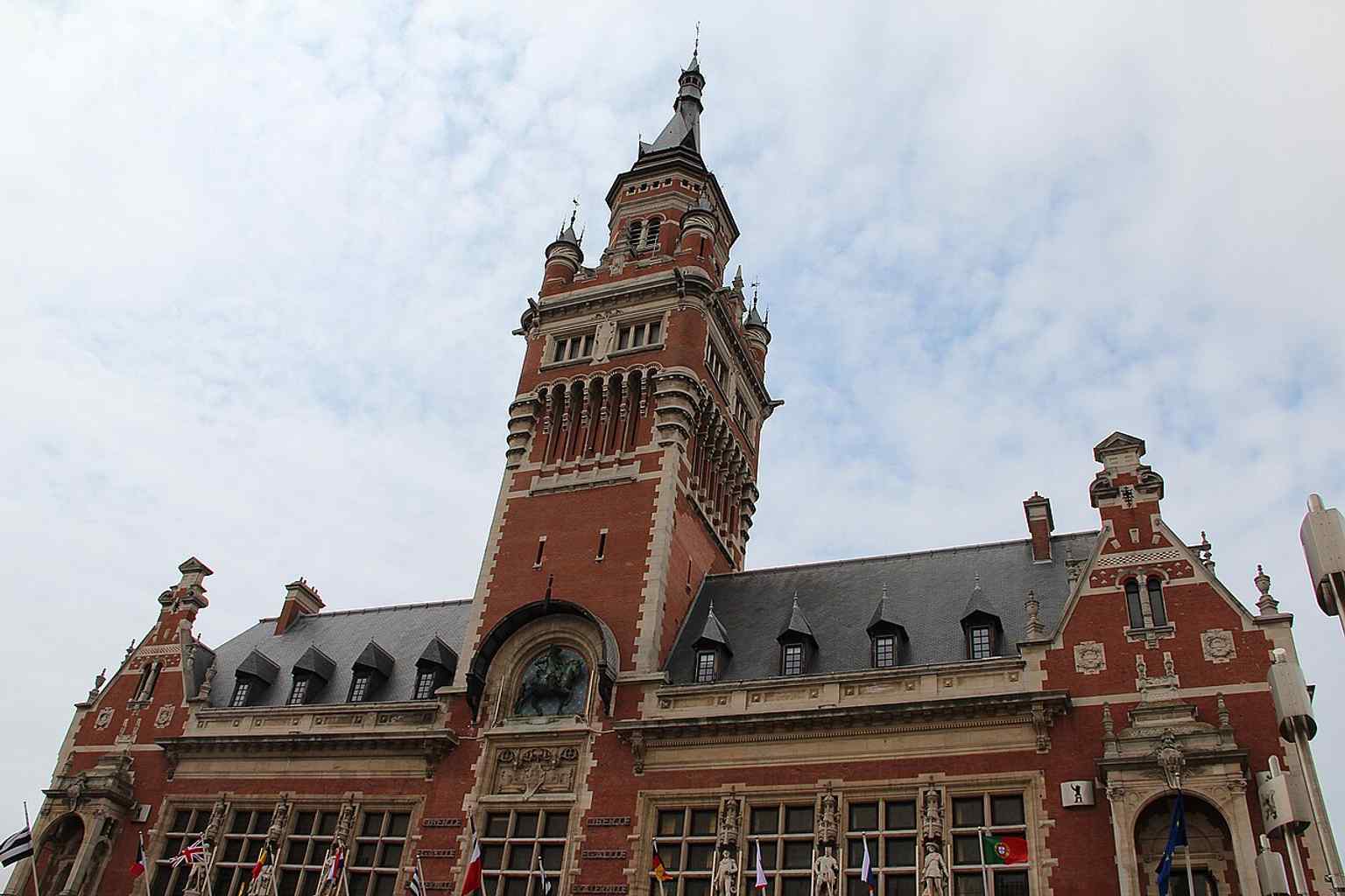 Another high-resolution exterior view that shows the symmetrical frontage and central clock tower that dominate the building’s design.