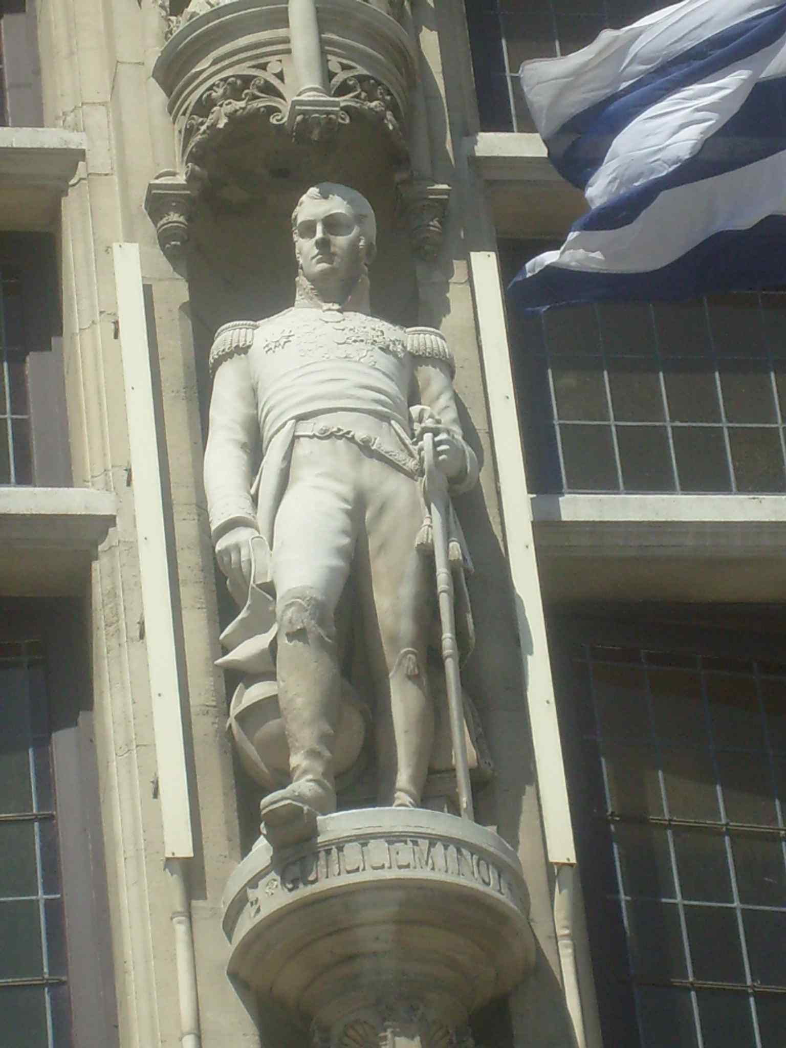 Statue of Armand Charles Guilleminot on the façade, one of the historical figures carved into the city hall’s exterior.