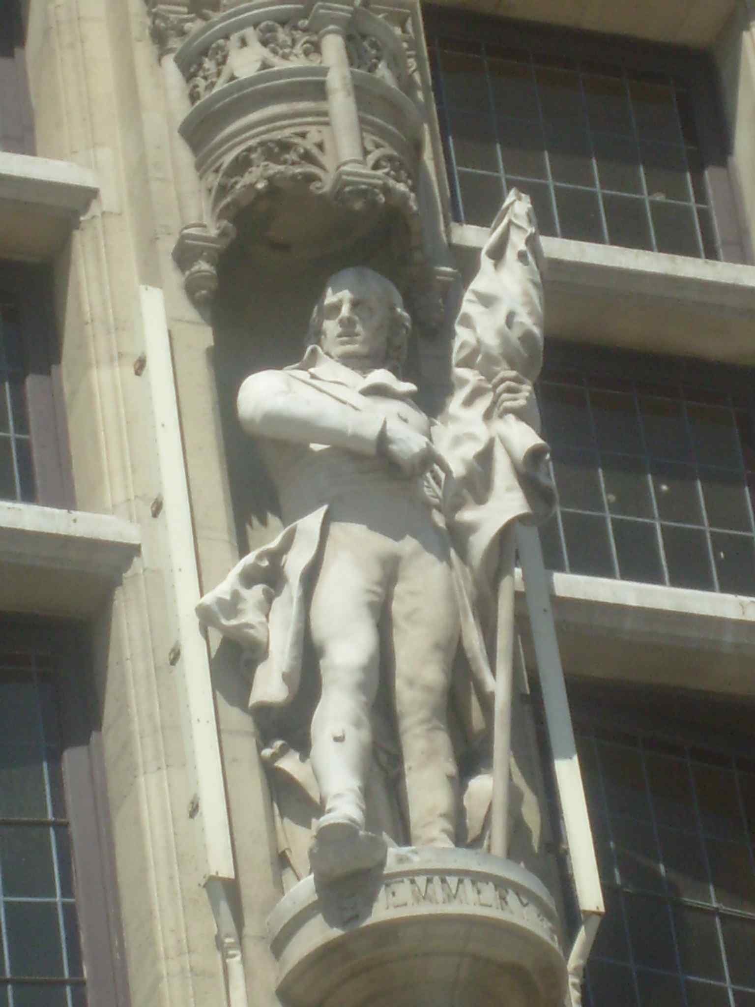 Jean-Marie Joseph Emmery appears here as a façade statue, one of six notable local and regional figures on the building.