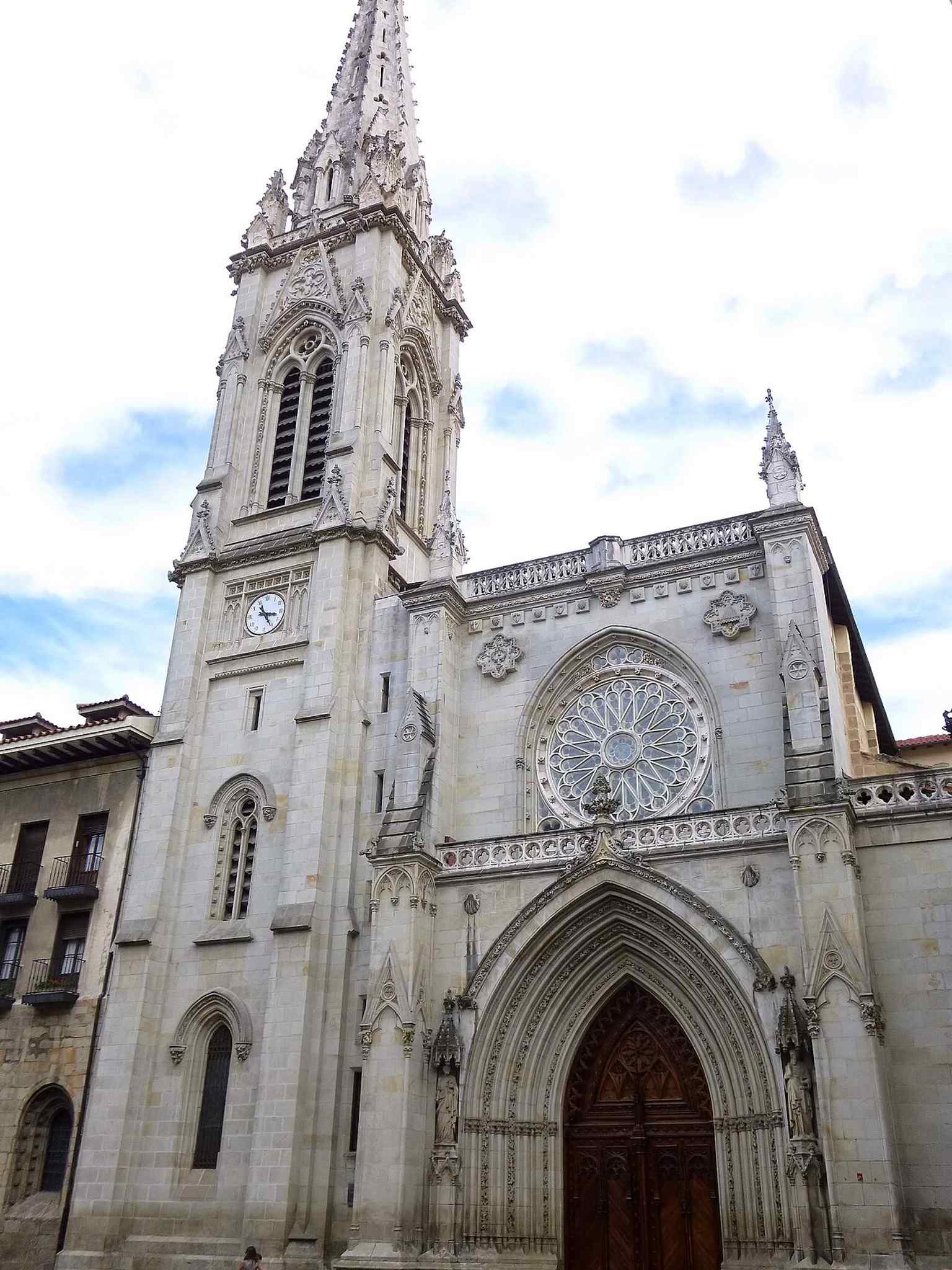 West façade of Santiago Cathedral, rebuilt in the 1880s in Neo-Gothic style with the tower and spire that define its modern silhouette.