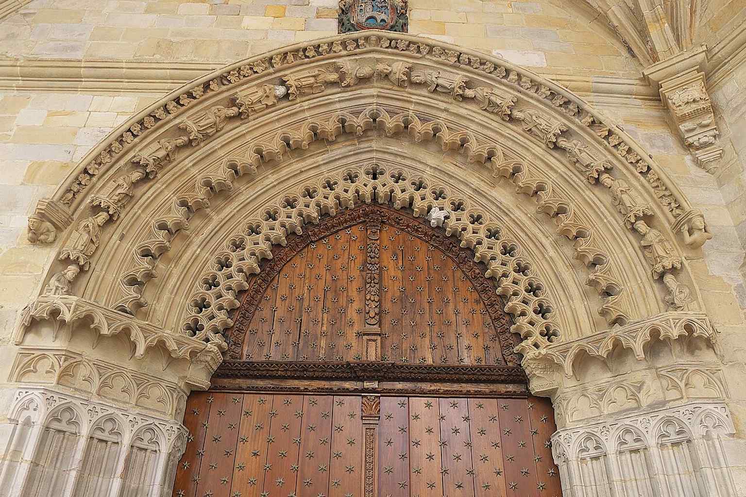 South portal archivolts and carvings from the 14th-century Gothic entrance, one of the cathedral’s key medieval access points.