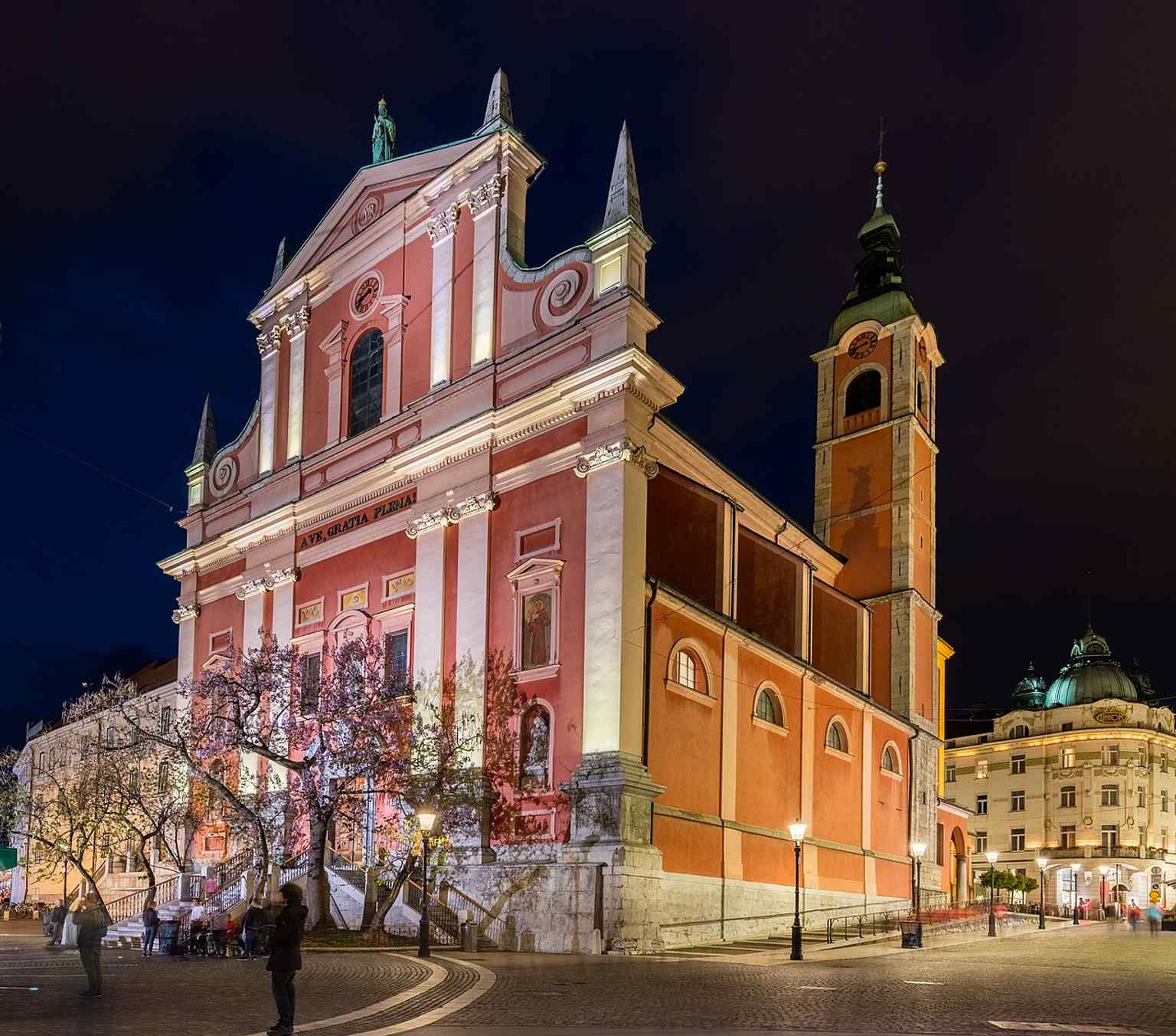 An aerial view from Ljubljana Castle highlights the church's strategic location near Prešeren Square, making it one of the city's most visited churches.